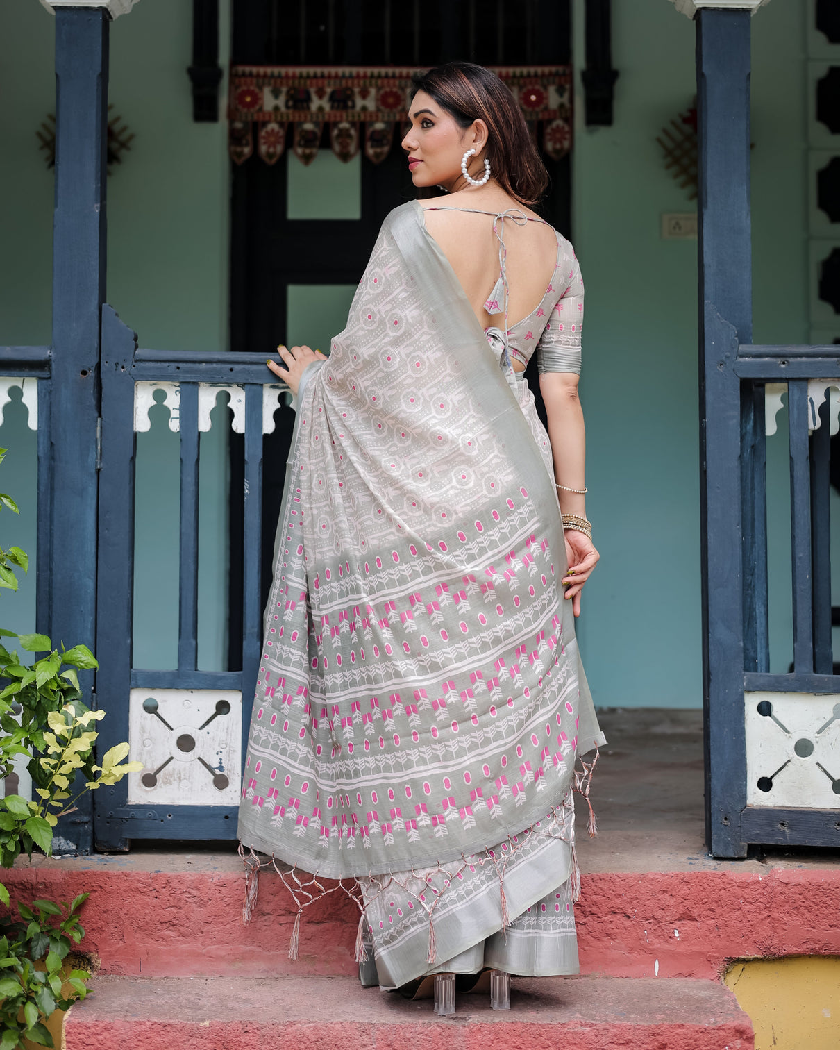 Soft grey pure cotton linen saree with pink and white ikat design blouse and tassel detailing
