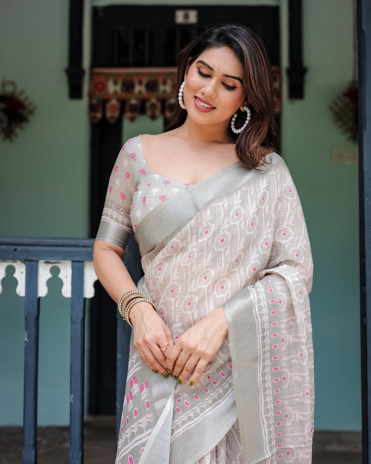 Soft grey pure cotton linen saree with pink and white ikat design blouse and tassel detailing