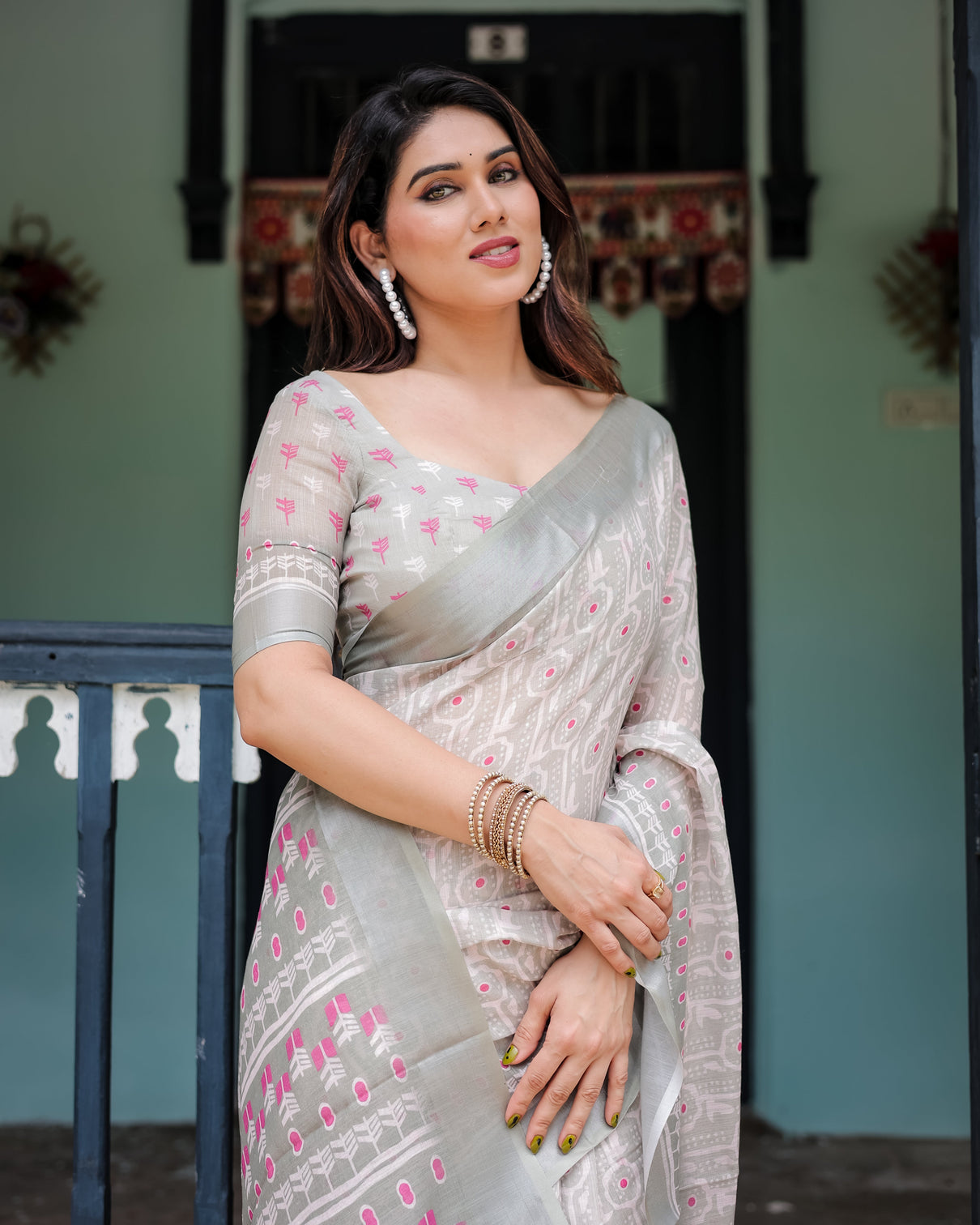 Soft grey pure cotton linen saree with pink and white ikat design blouse and tassel detailing