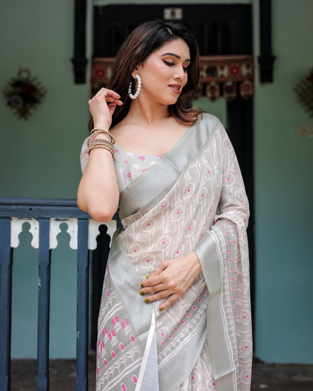 Soft grey pure cotton linen saree with pink and white ikat design blouse and tassel detailing