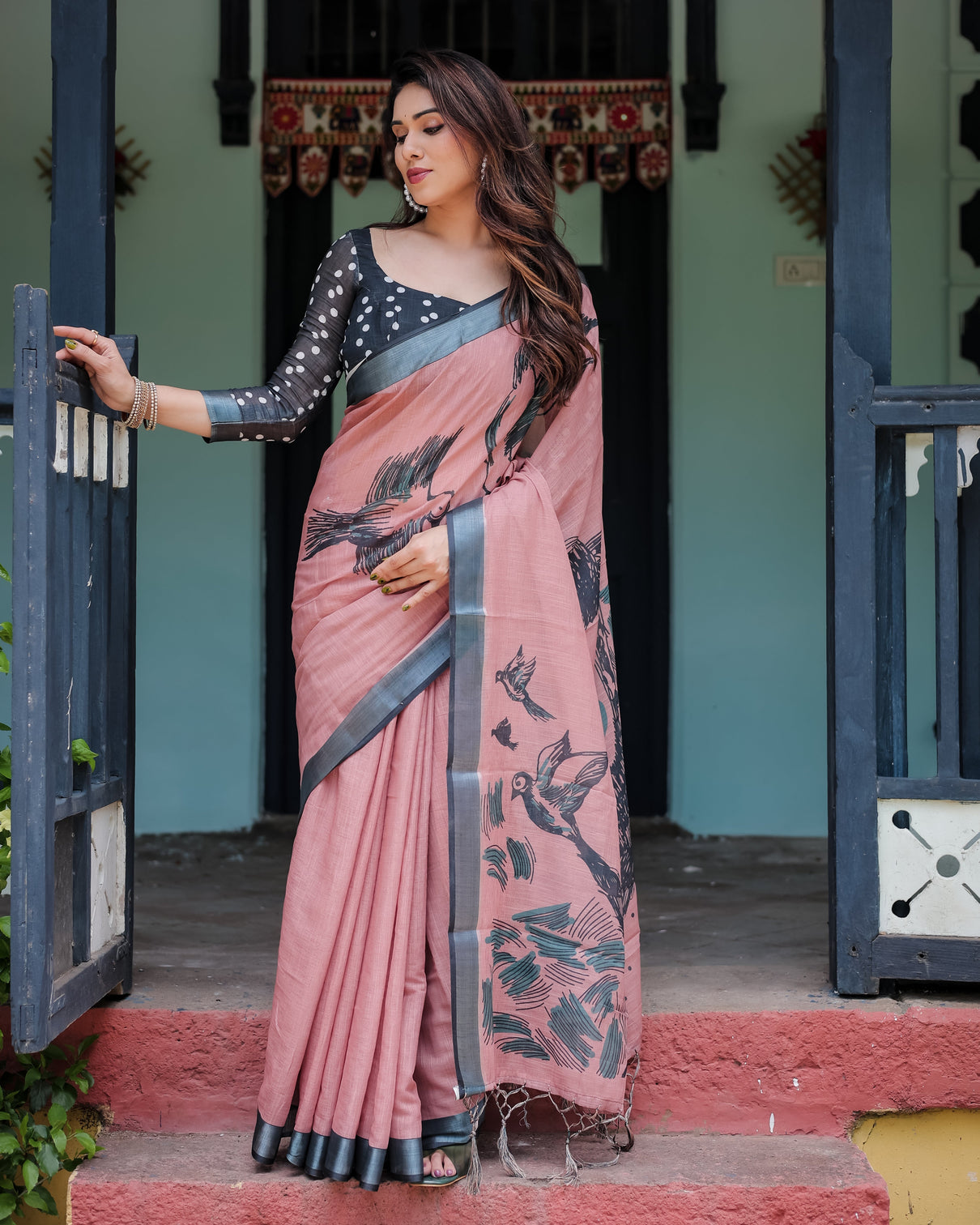 Blush pink pure cotton linen saree with contrast polka dot blouse and tassel detailing