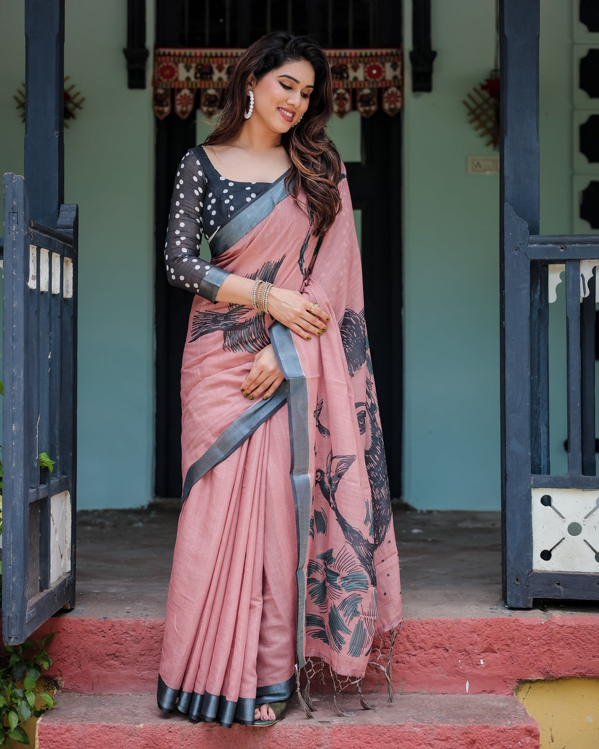 Blush pink pure cotton linen saree with contrast polka dot blouse and tassel detailing