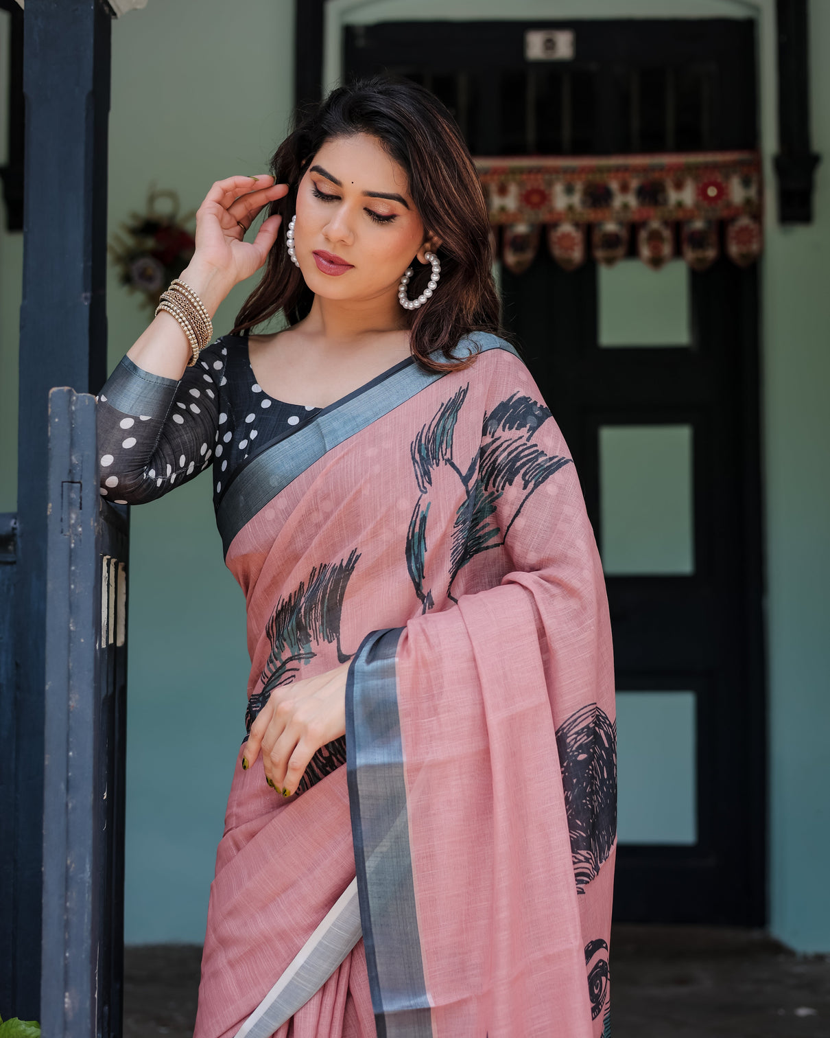 Blush pink pure cotton linen saree with contrast polka dot blouse and tassel detailing