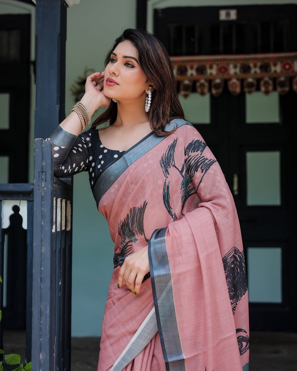 Blush pink pure cotton linen saree with contrast polka dot blouse and tassel detailing