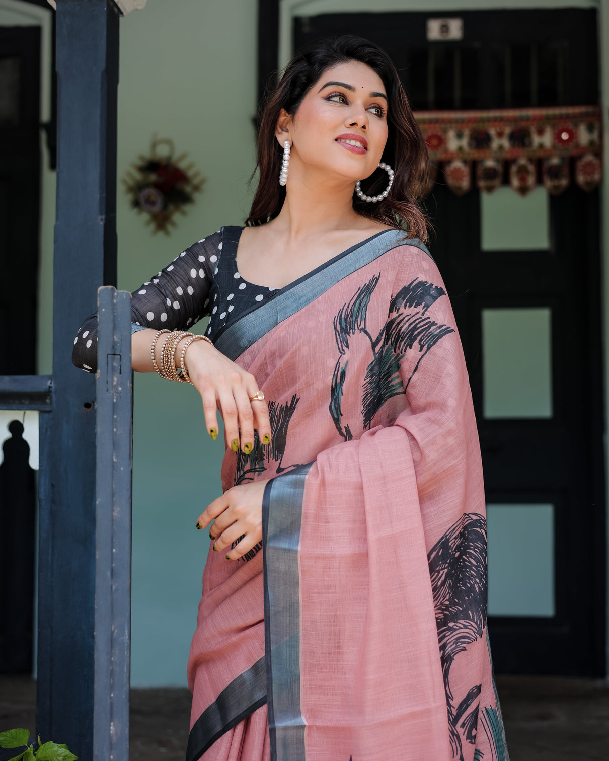 Blush pink pure cotton linen saree with contrast polka dot blouse and tassel detailing