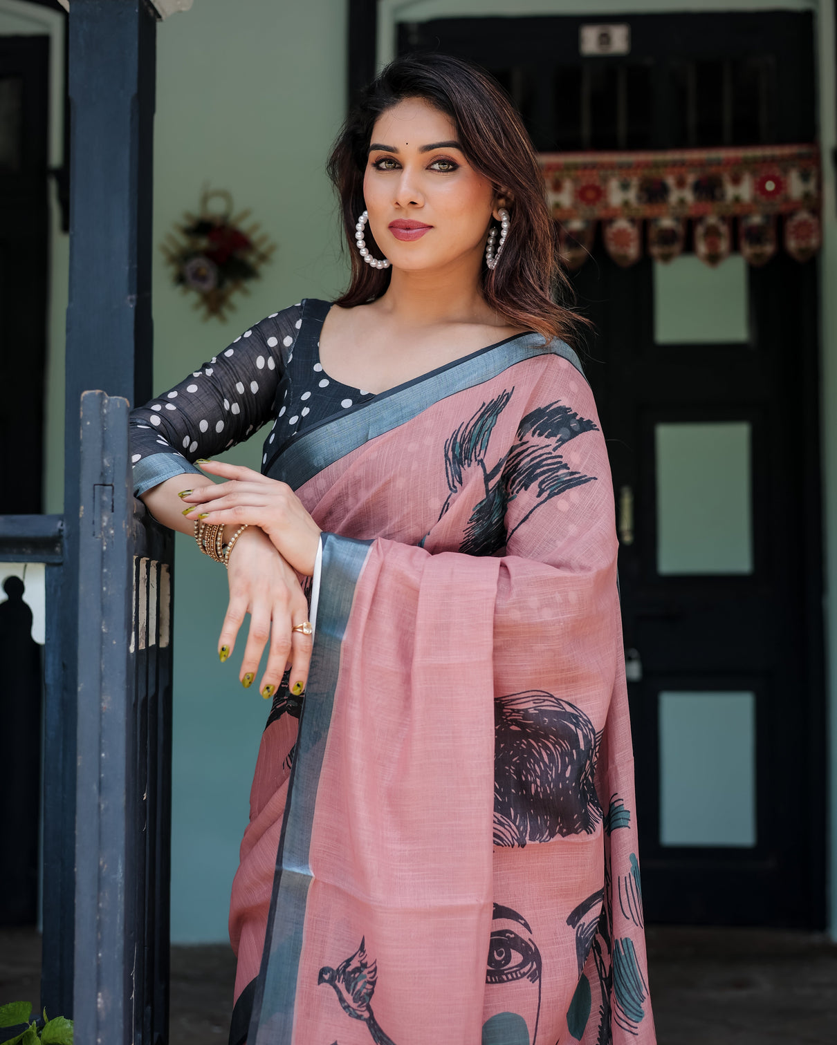 Blush pink pure cotton linen saree with contrast polka dot blouse and tassel detailing