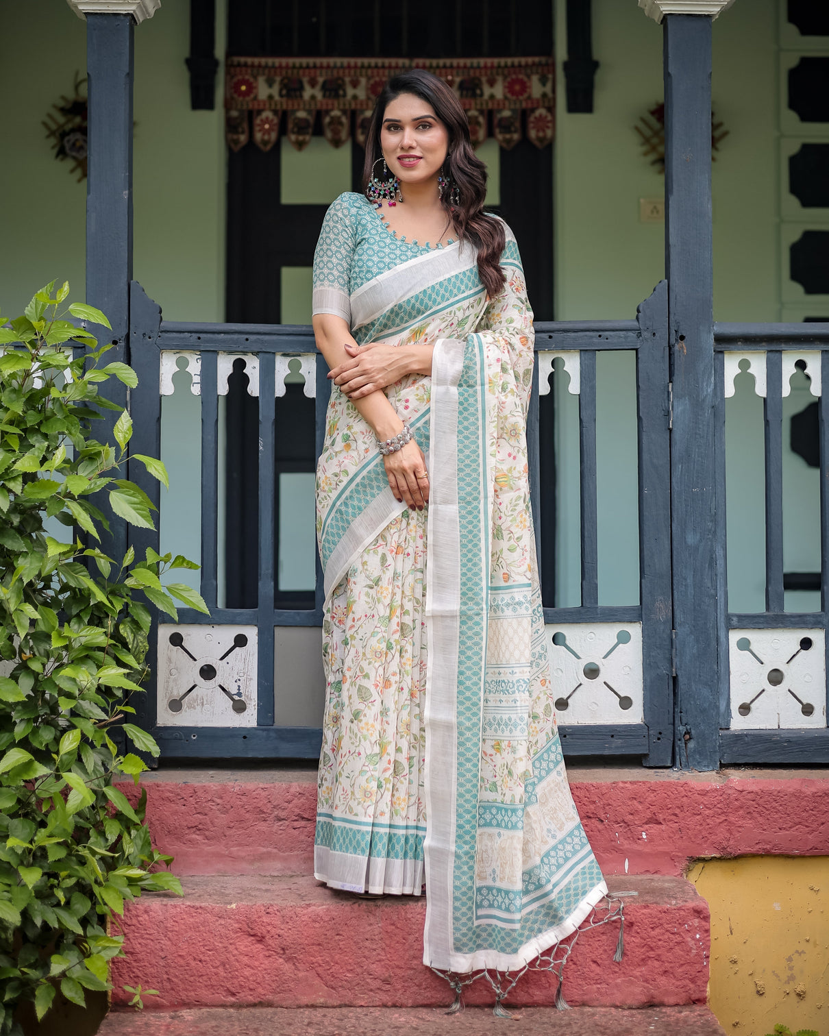 Elegant floral printed pure cotton linen saree in ivory with teal border and blouse tassels on edges mameraa