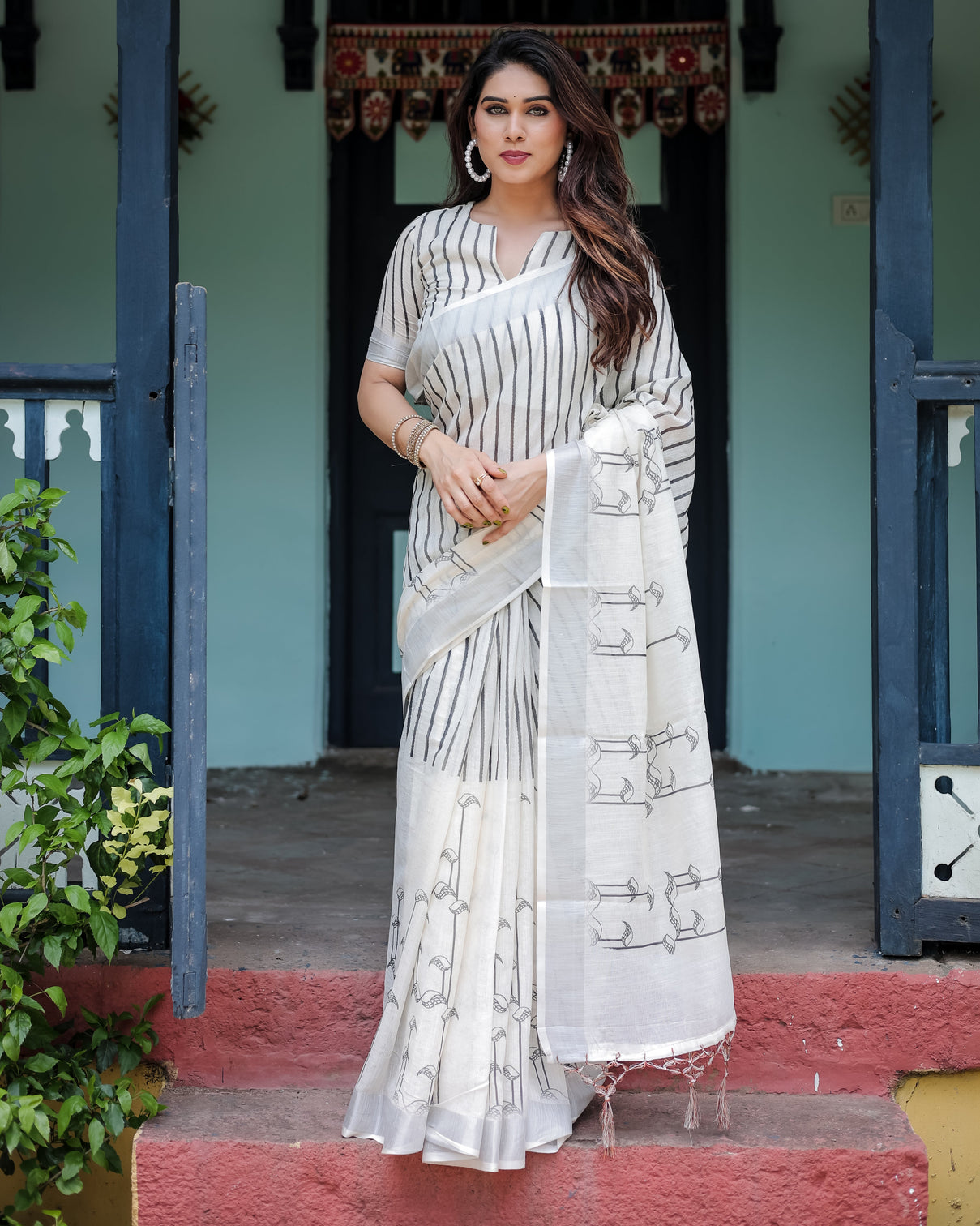 White and black pure cotton linen saree with striped pattern blouse and tassel detailing mameraa