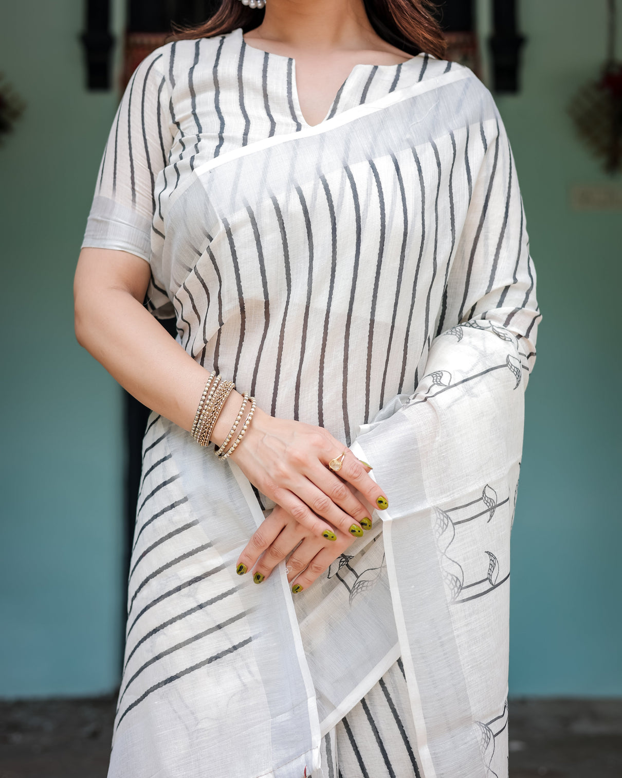 White and black pure cotton linen saree with striped pattern blouse and tassel detailing