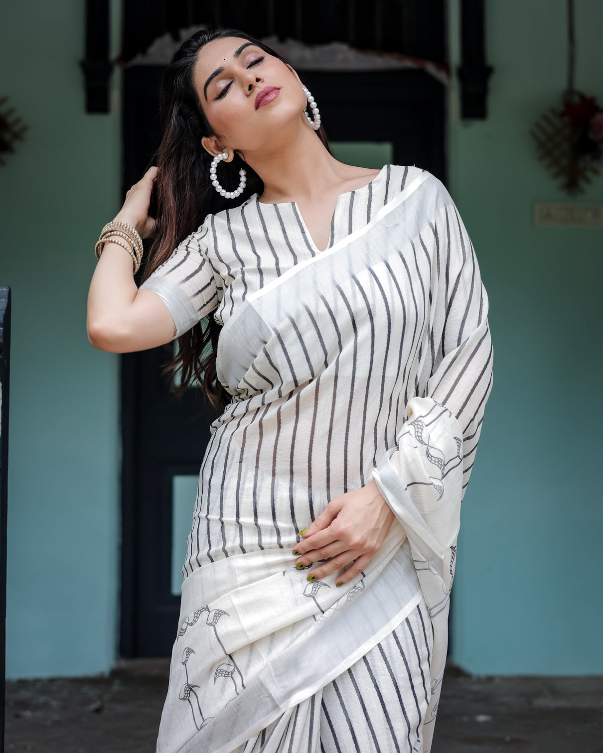 White and black pure cotton linen saree with striped pattern blouse and tassel detailing