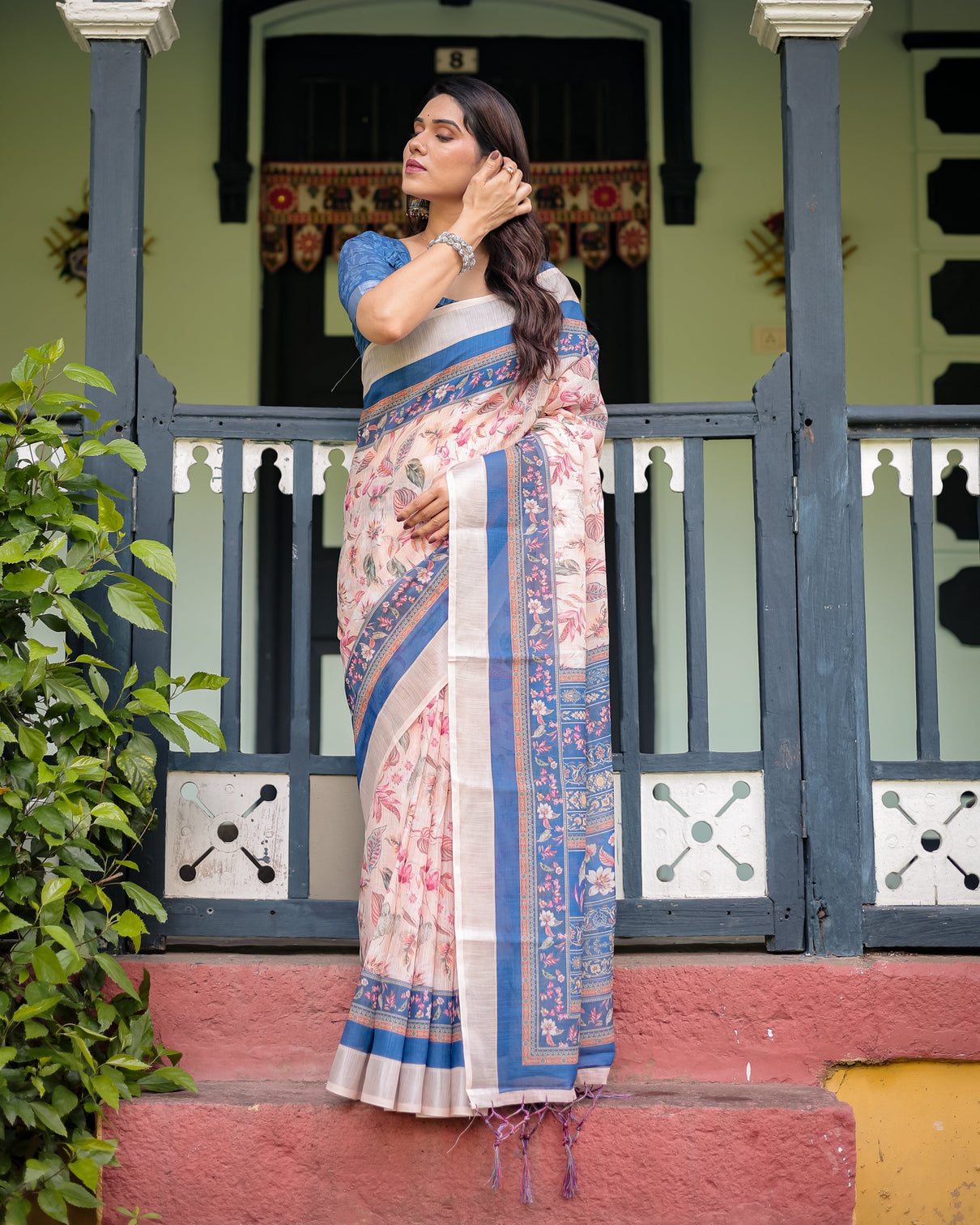 Pure cotton linen saree with blue floral border and pink leaf design with tassels on edges