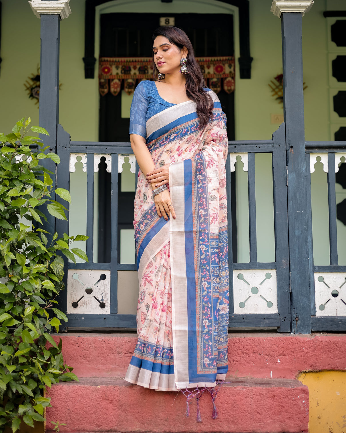 Pure cotton linen saree with blue floral border and pink leaf design with tassels on edges
