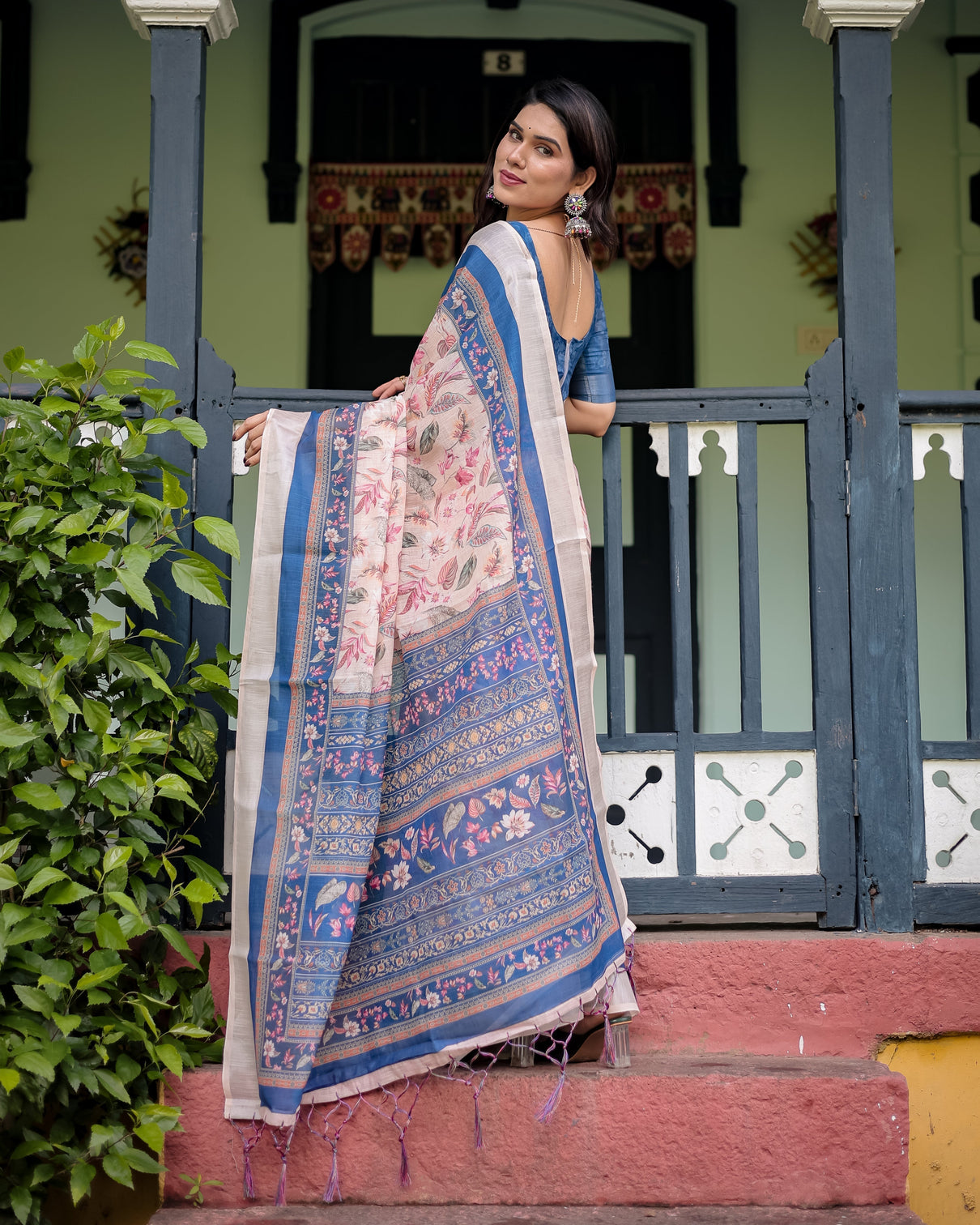 Pure cotton linen saree with blue floral border and pink leaf design with tassels on edges