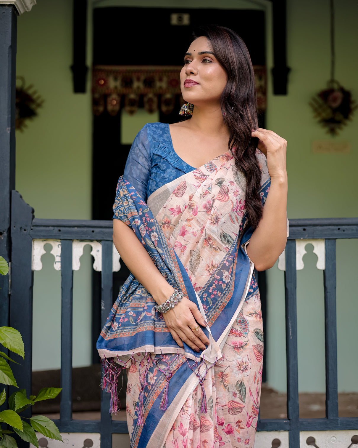 Pure cotton linen saree with blue floral border and pink leaf design with tassels on edges