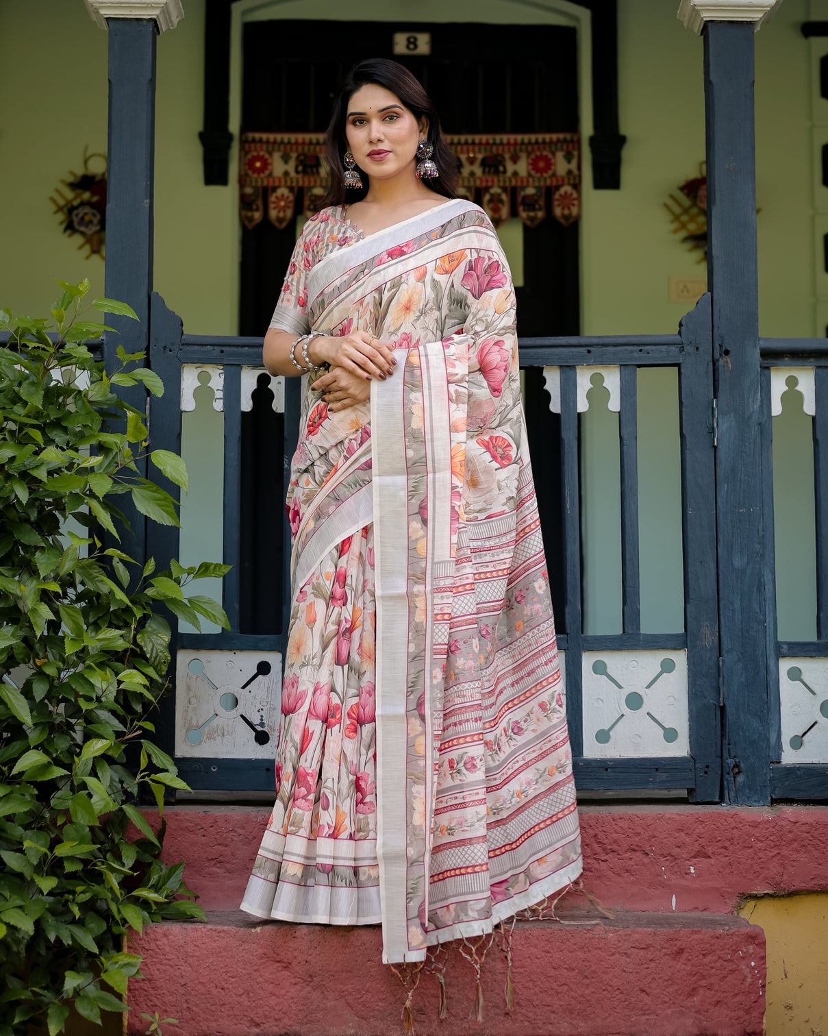 Elegant floral print pure cotton linen saree in ivory with multi color florals and tassels