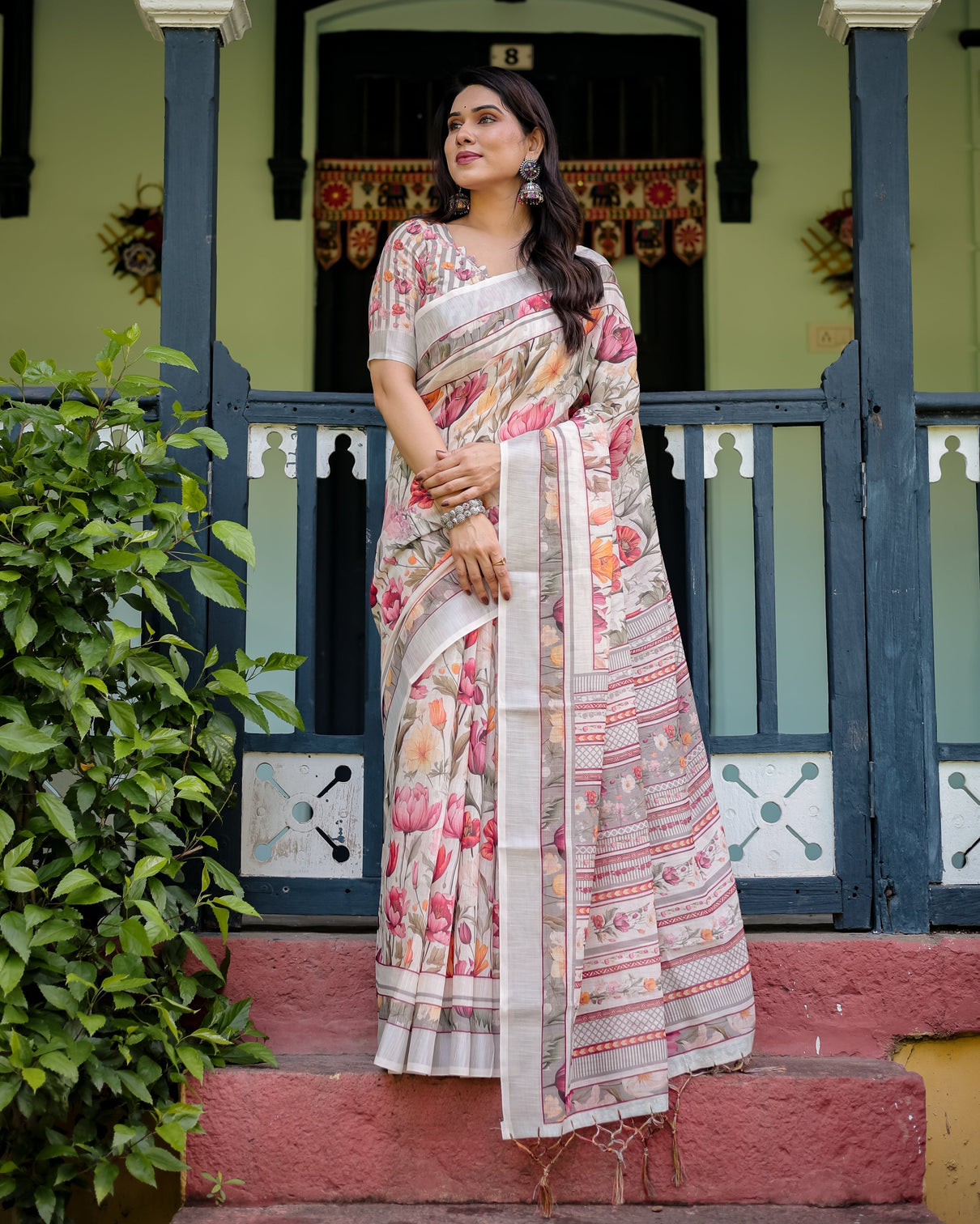 Elegant floral print pure cotton linen saree in ivory with multi color florals and tassels