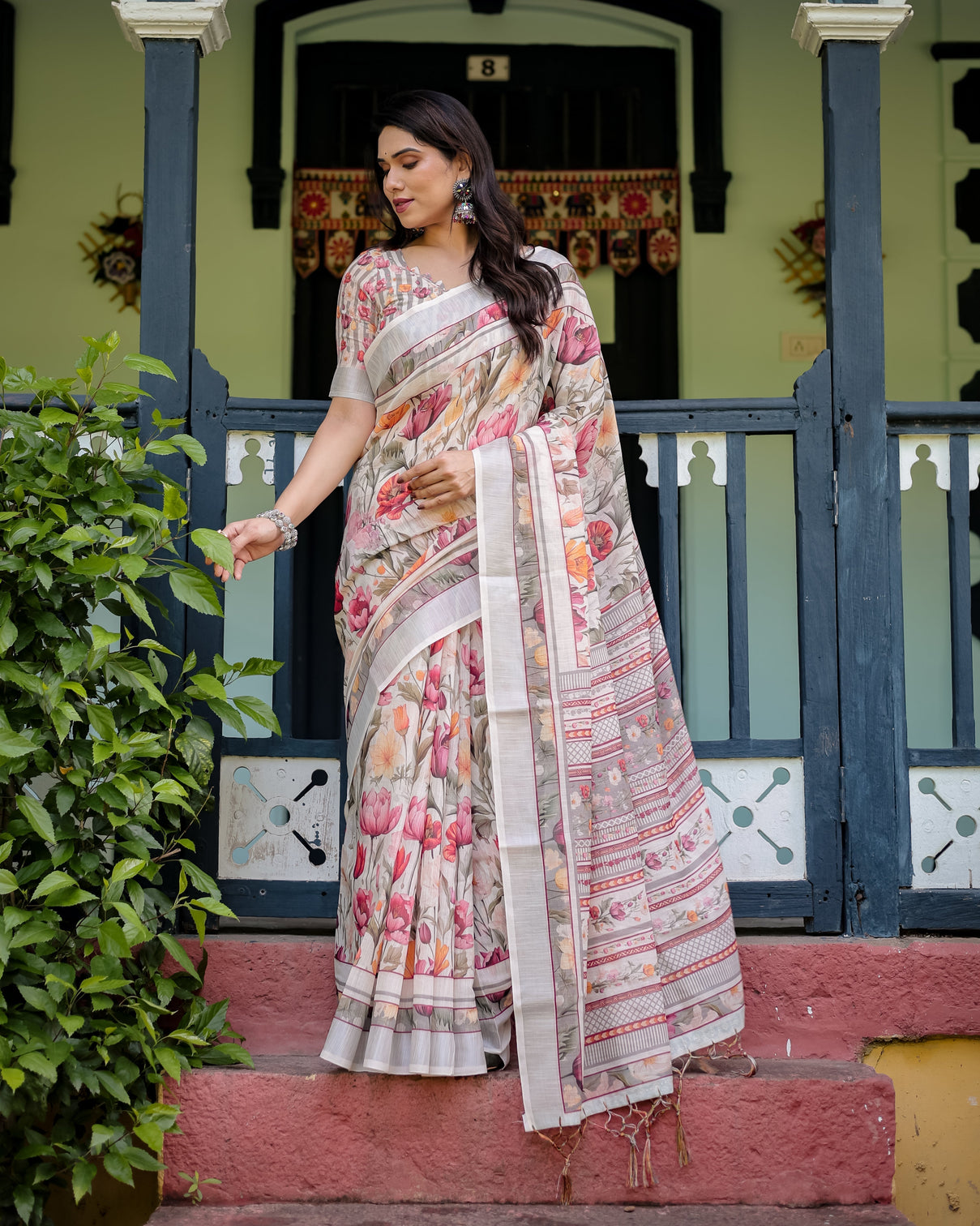 Elegant floral print pure cotton linen saree in ivory with multi color florals and tassels