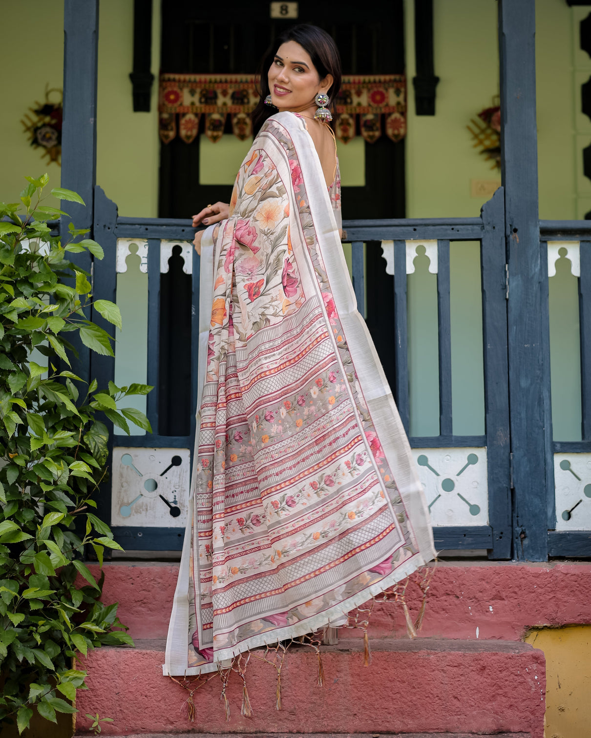 Elegant floral print pure cotton linen saree in ivory with multi color florals and tassels
