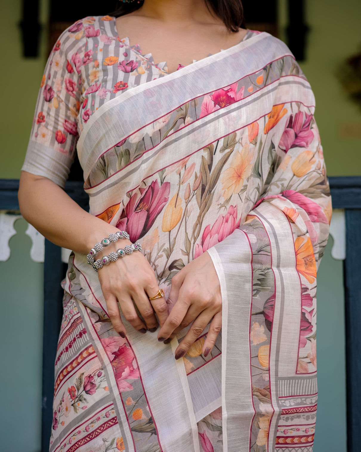 Elegant floral print pure cotton linen saree in ivory with multi color florals and tassels