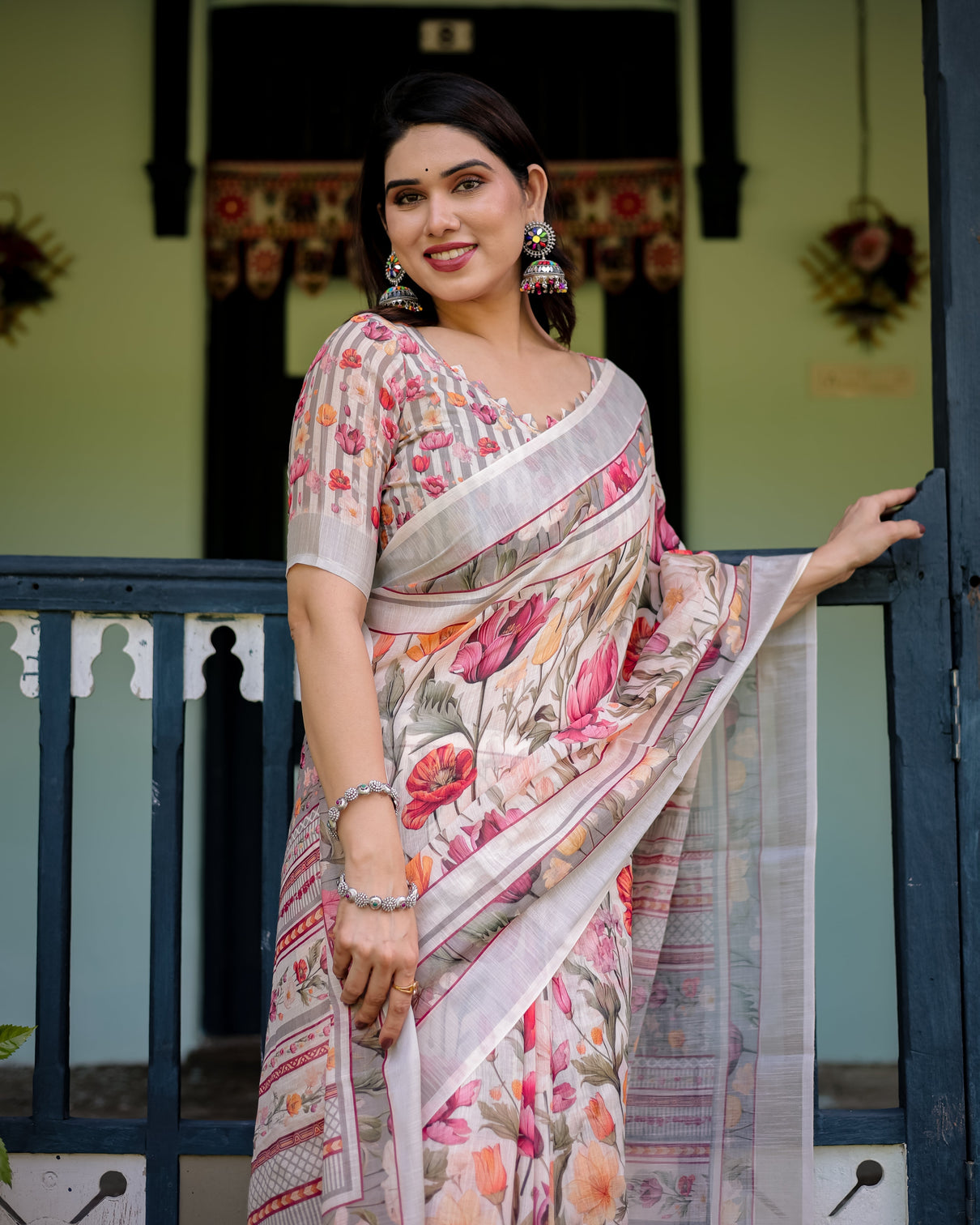 Elegant floral print pure cotton linen saree in ivory with multi color florals and tassels