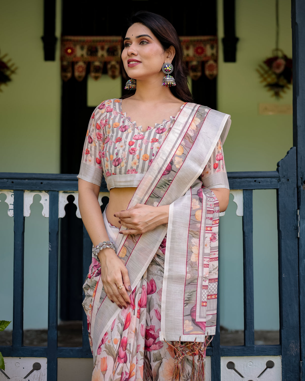 Elegant floral print pure cotton linen saree in ivory with multi color florals and tassels