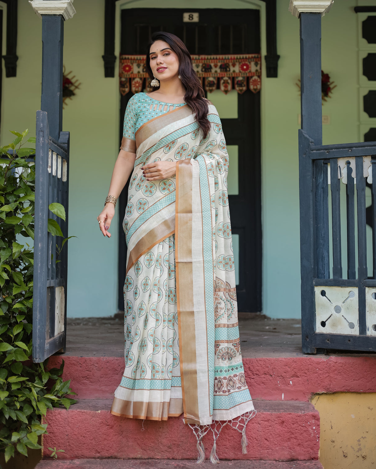 Beige with aqua pure cotton linen saree with geometric floral design and tassels on edges