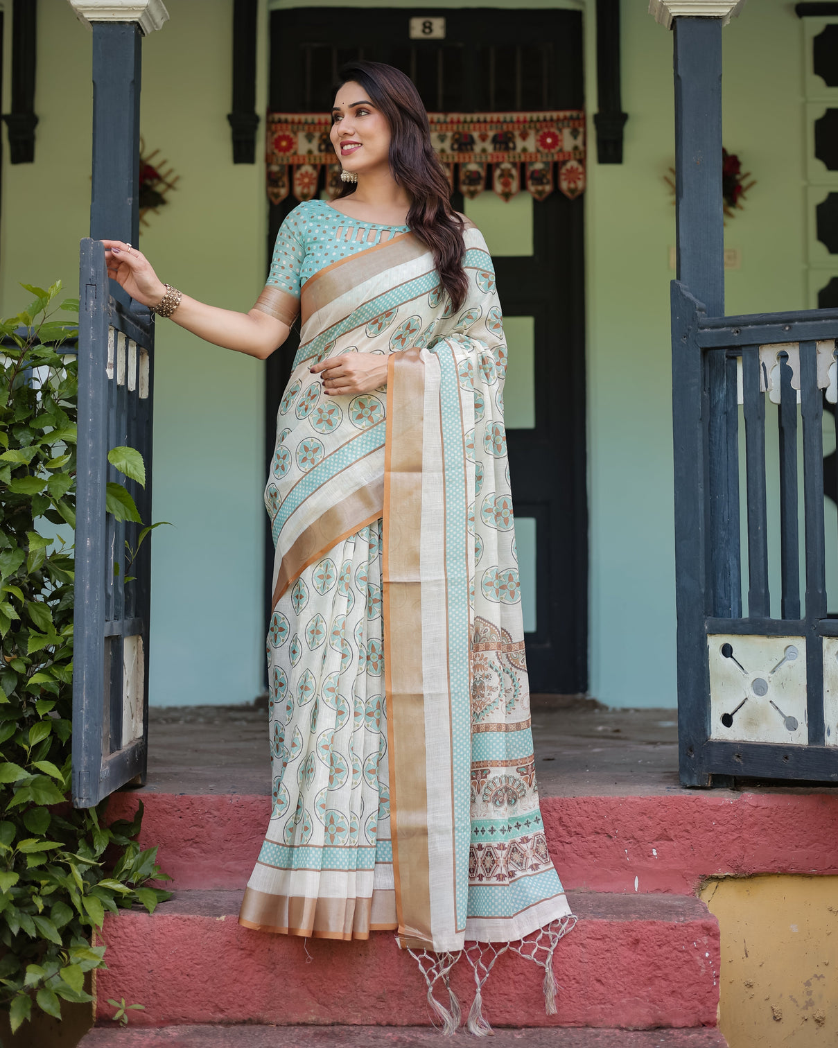 Beige with aqua pure cotton linen saree with geometric floral design and tassels on edges