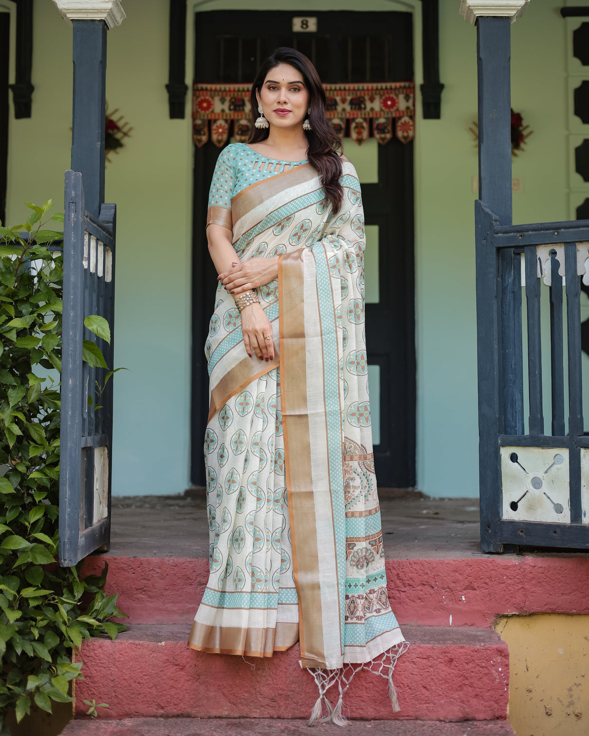 Beige with aqua pure cotton linen saree with geometric floral design and tassels on edges