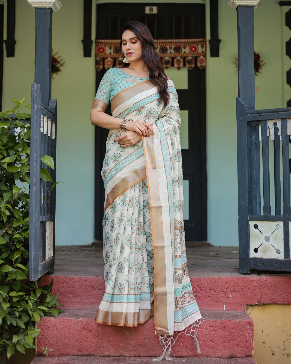 Beige with aqua pure cotton linen saree with geometric floral design and tassels on edges
