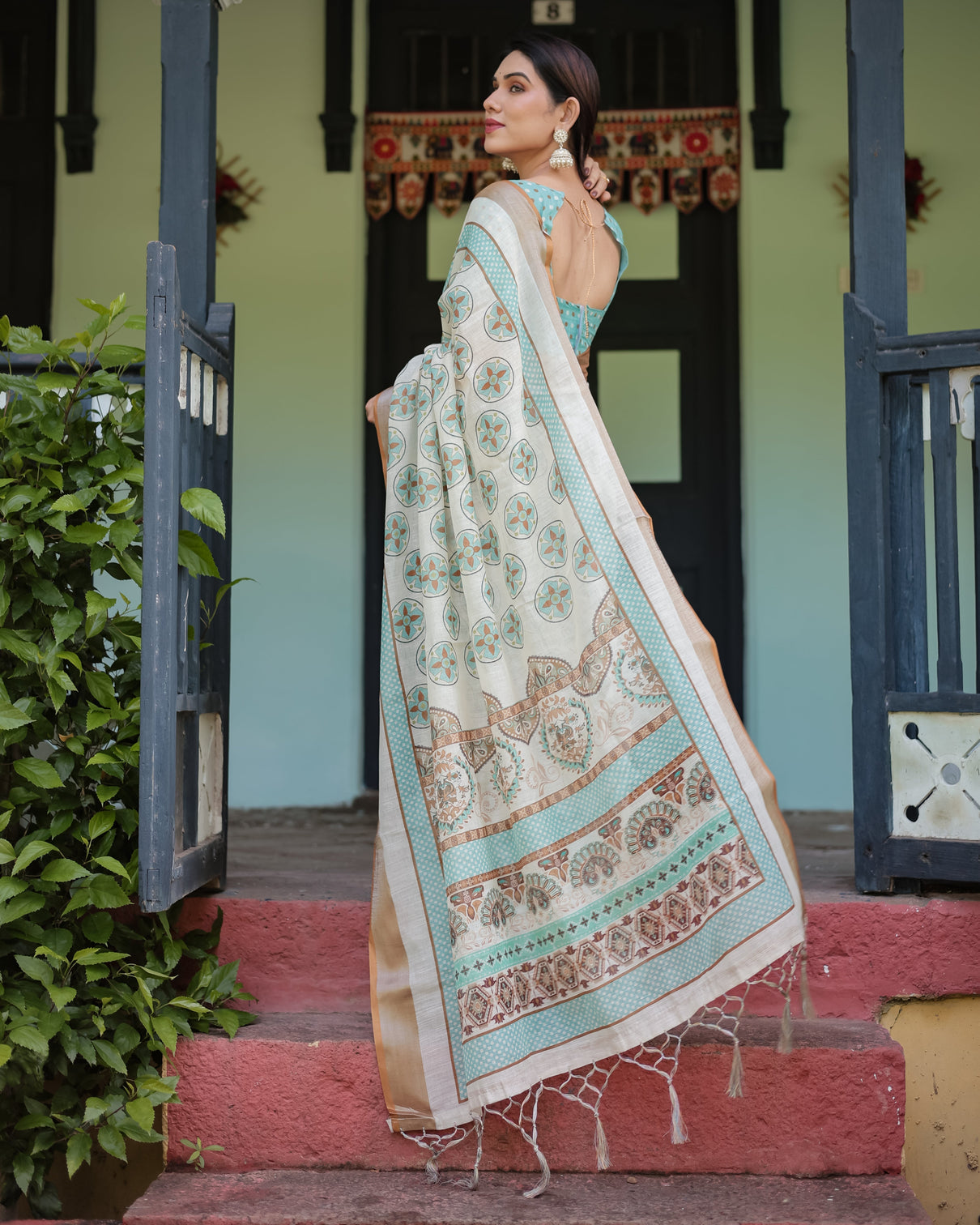 Beige with aqua pure cotton linen saree with geometric floral design and tassels on edges