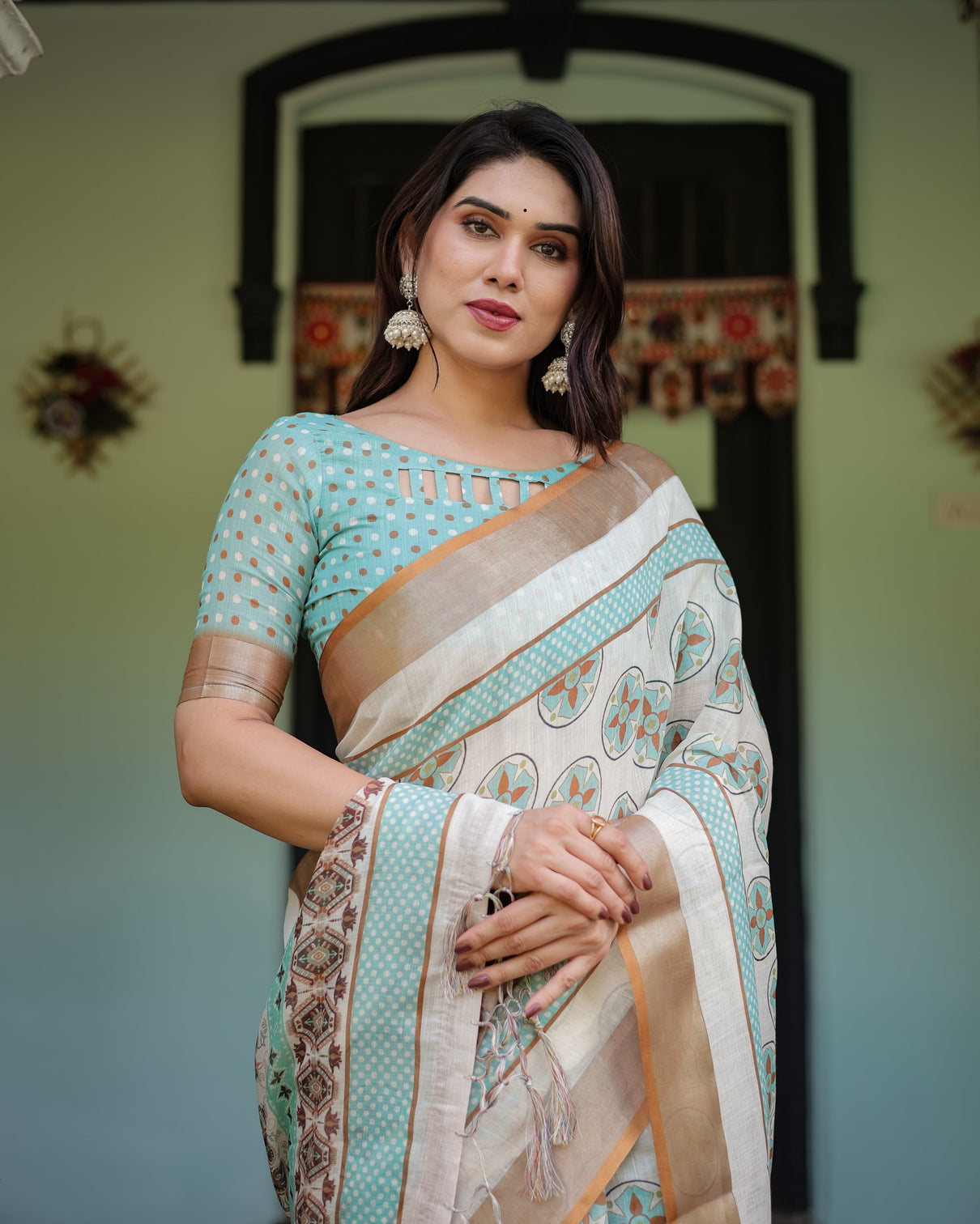 Beige with aqua pure cotton linen saree with geometric floral design and tassels on edges