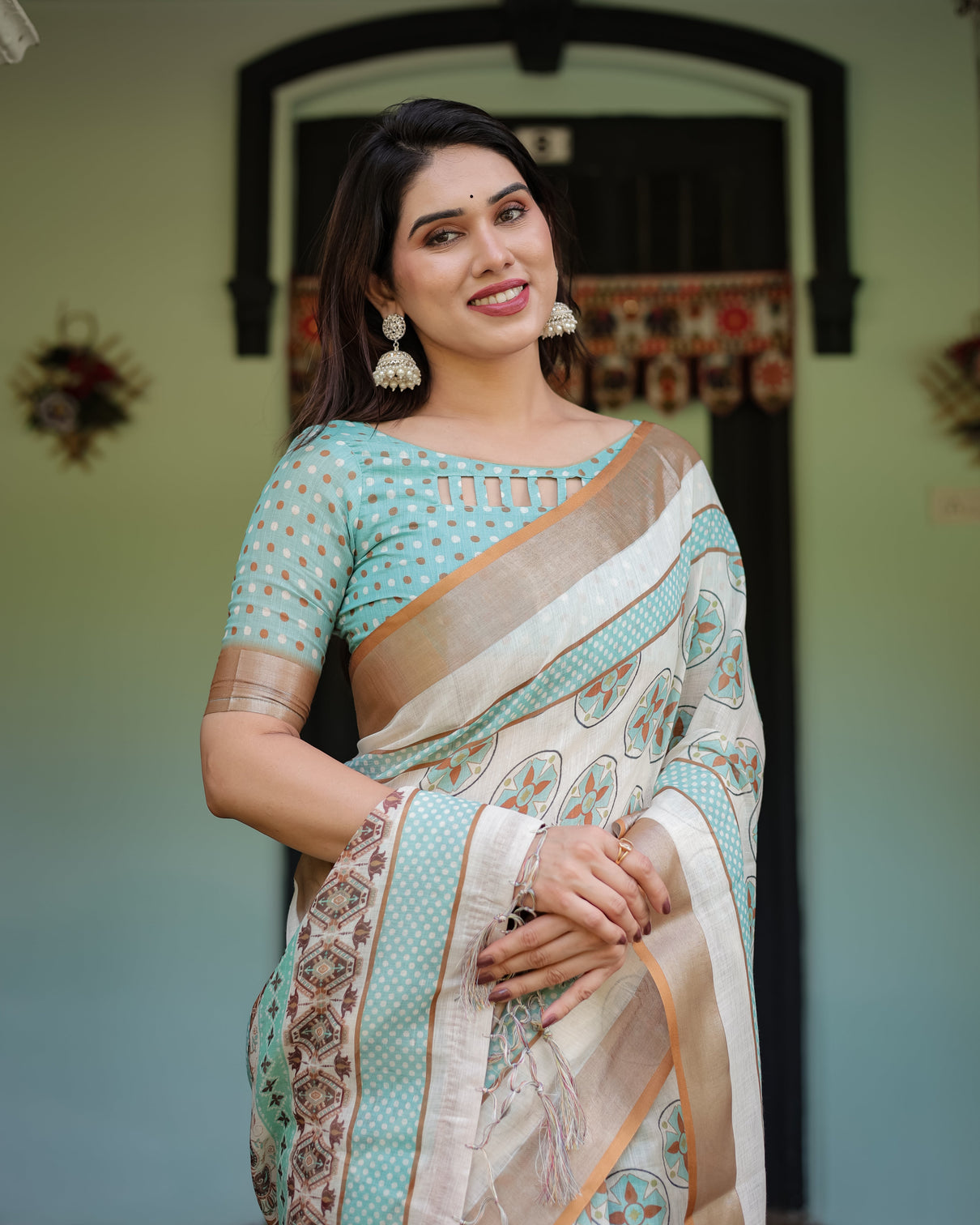 Beige with aqua pure cotton linen saree with geometric floral design and tassels on edges