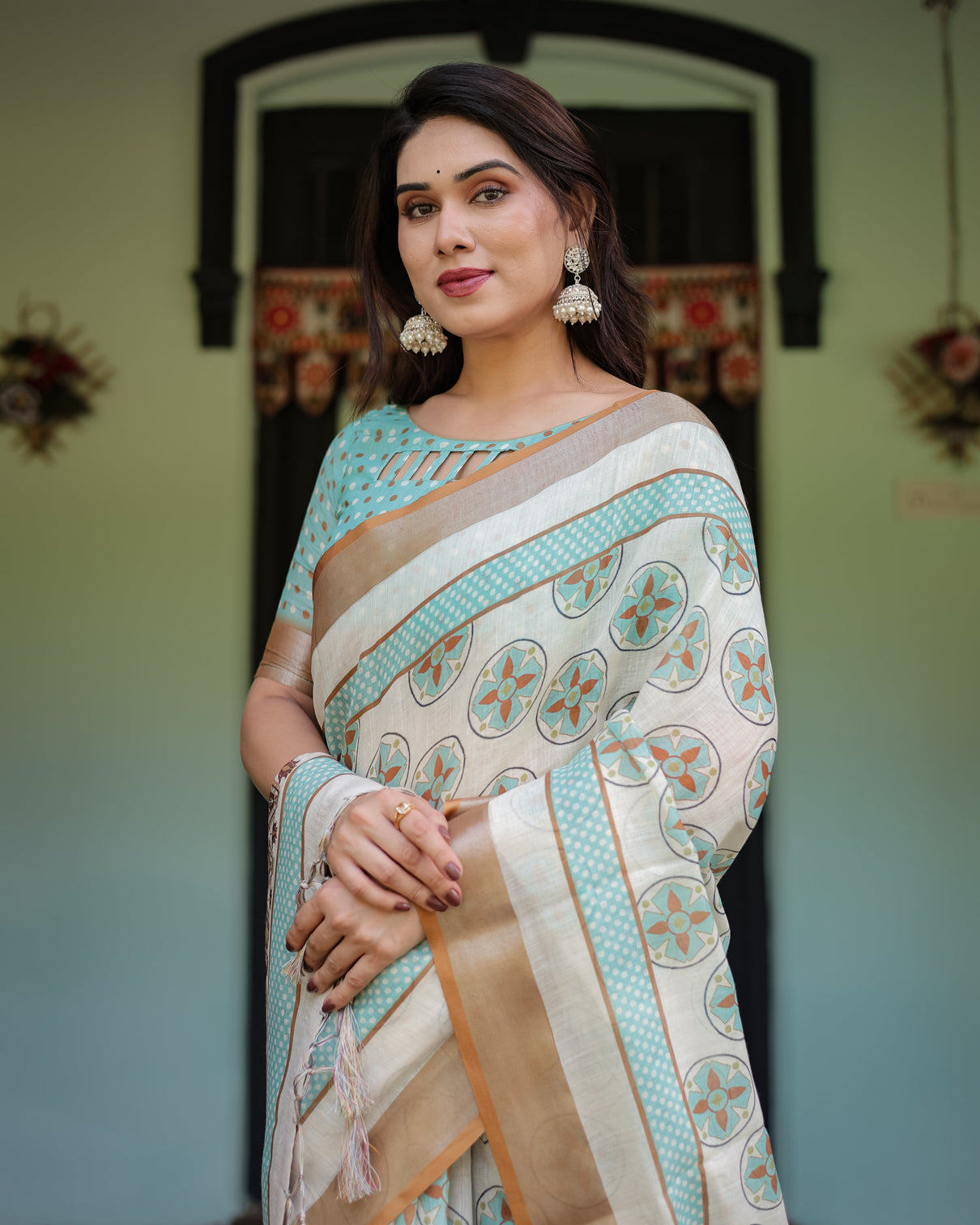Beige with aqua pure cotton linen saree with geometric floral design and tassels on edges