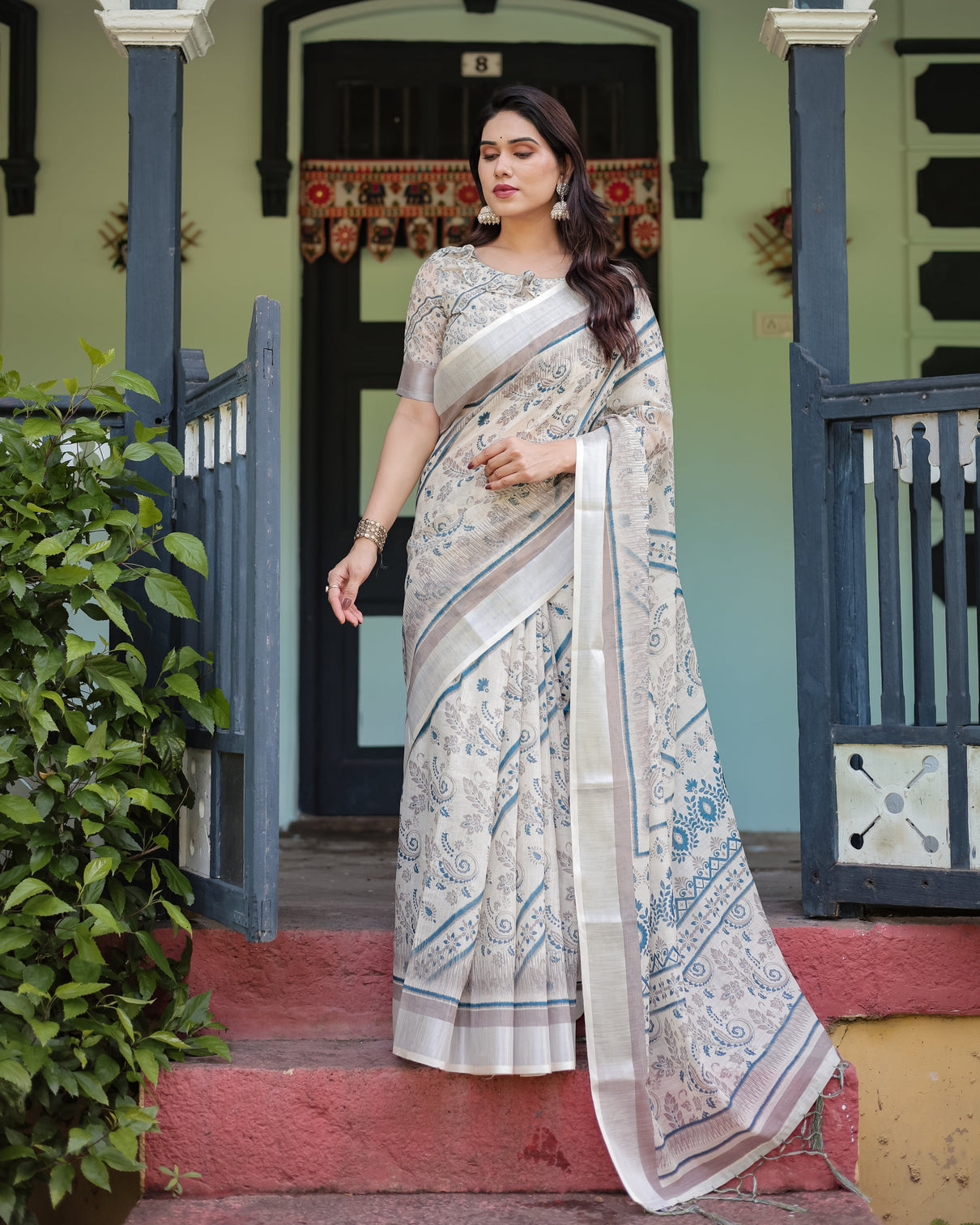 Beige and blue floral printed pure cotton linen saree with blouse and tassels