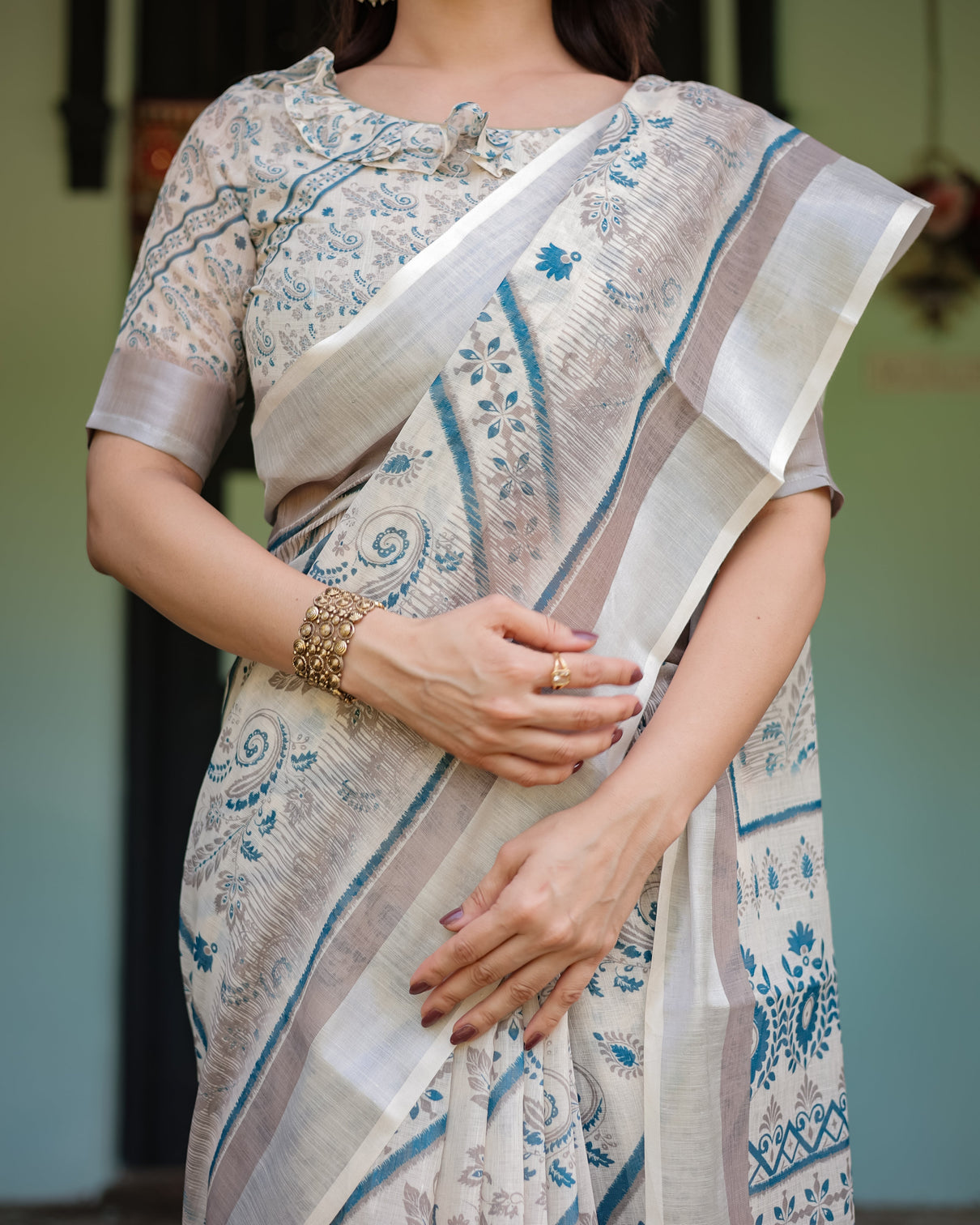 Beige and blue floral printed pure cotton linen saree with blouse and tassels