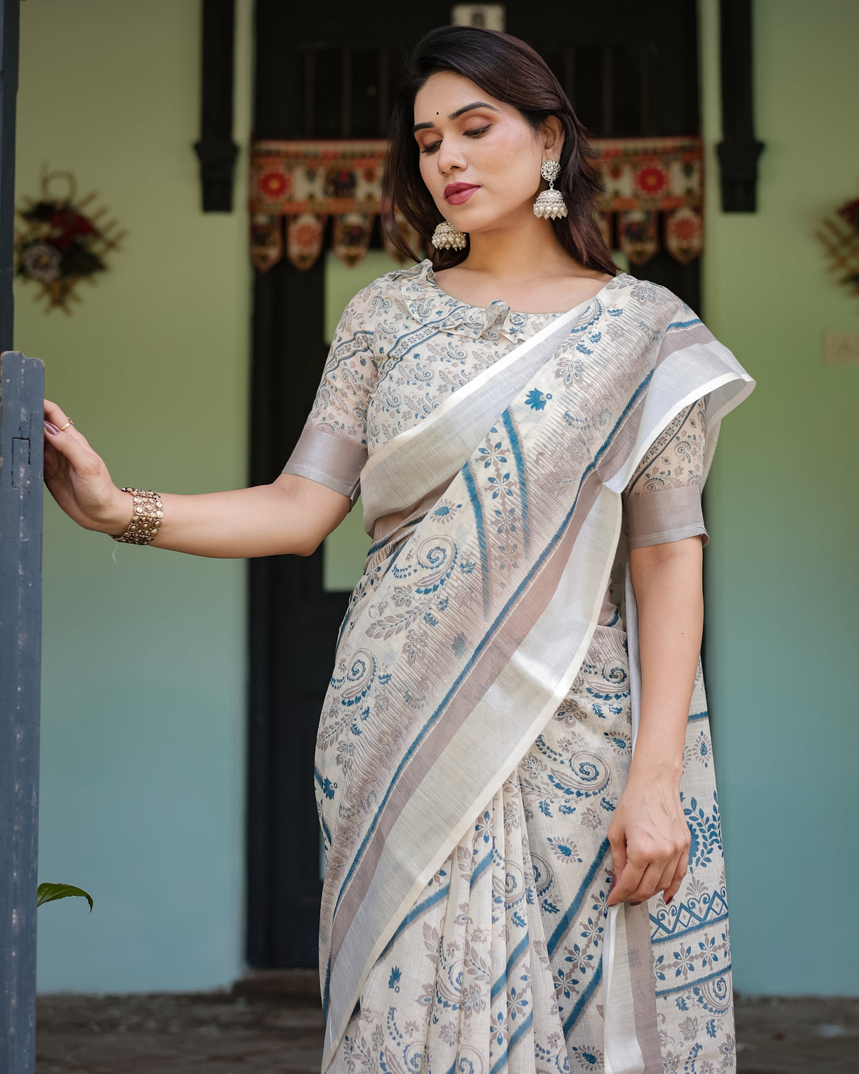 Beige and blue floral printed pure cotton linen saree with blouse and tassels