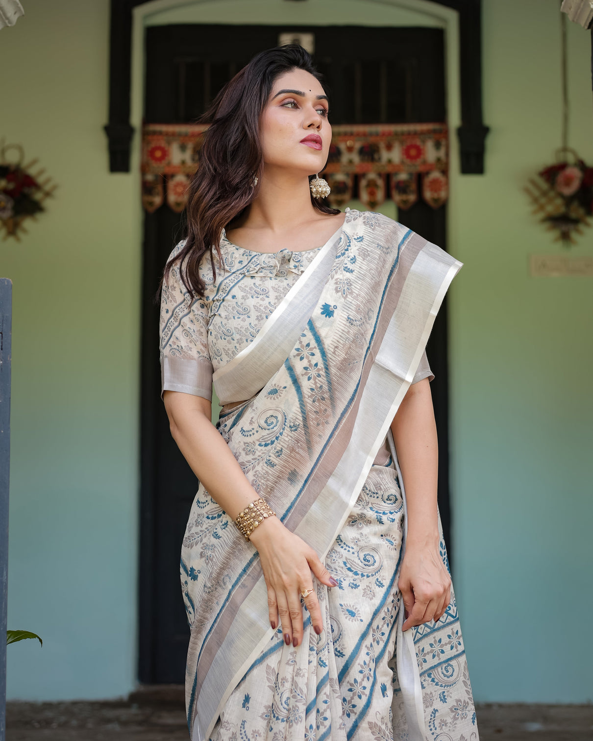 Beige and blue floral printed pure cotton linen saree with blouse and tassels
