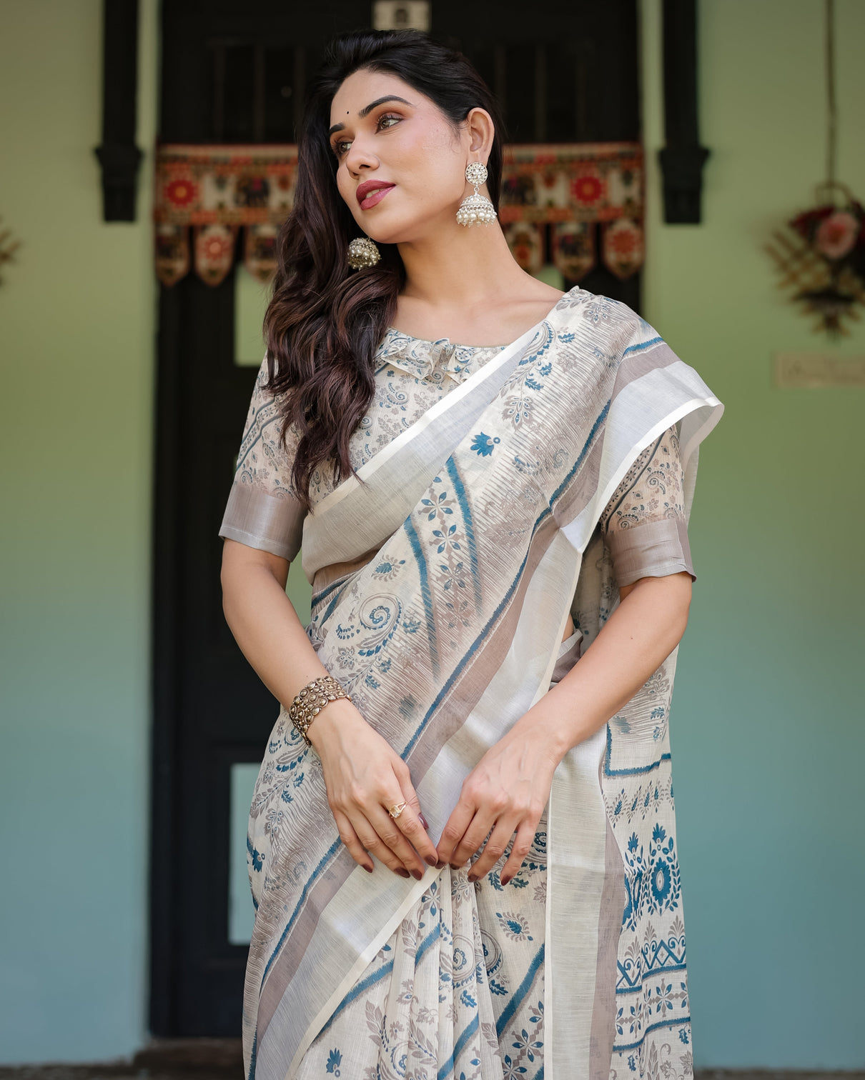 Beige and blue floral printed pure cotton linen saree with blouse and tassels