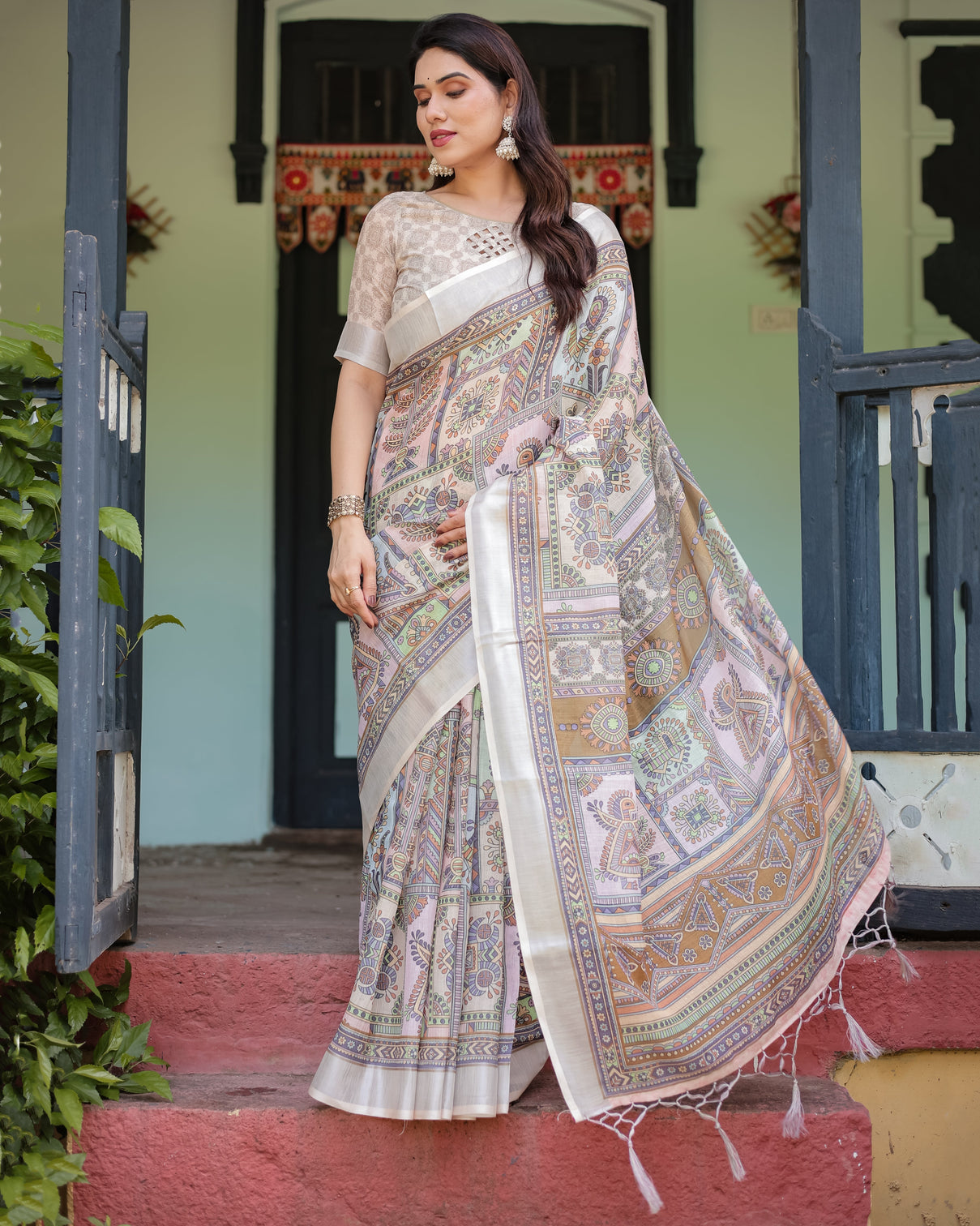 Cream and pastel multicolour printed pure cotton linen saree with blouse and tassels on edges
