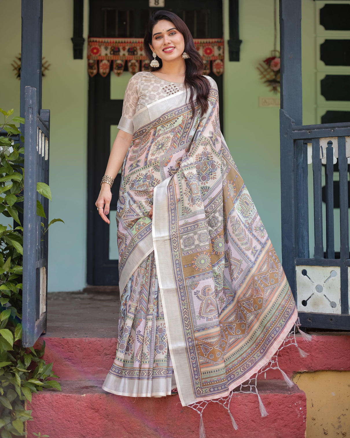 Cream and pastel multicolour printed pure cotton linen saree with blouse and tassels on edges