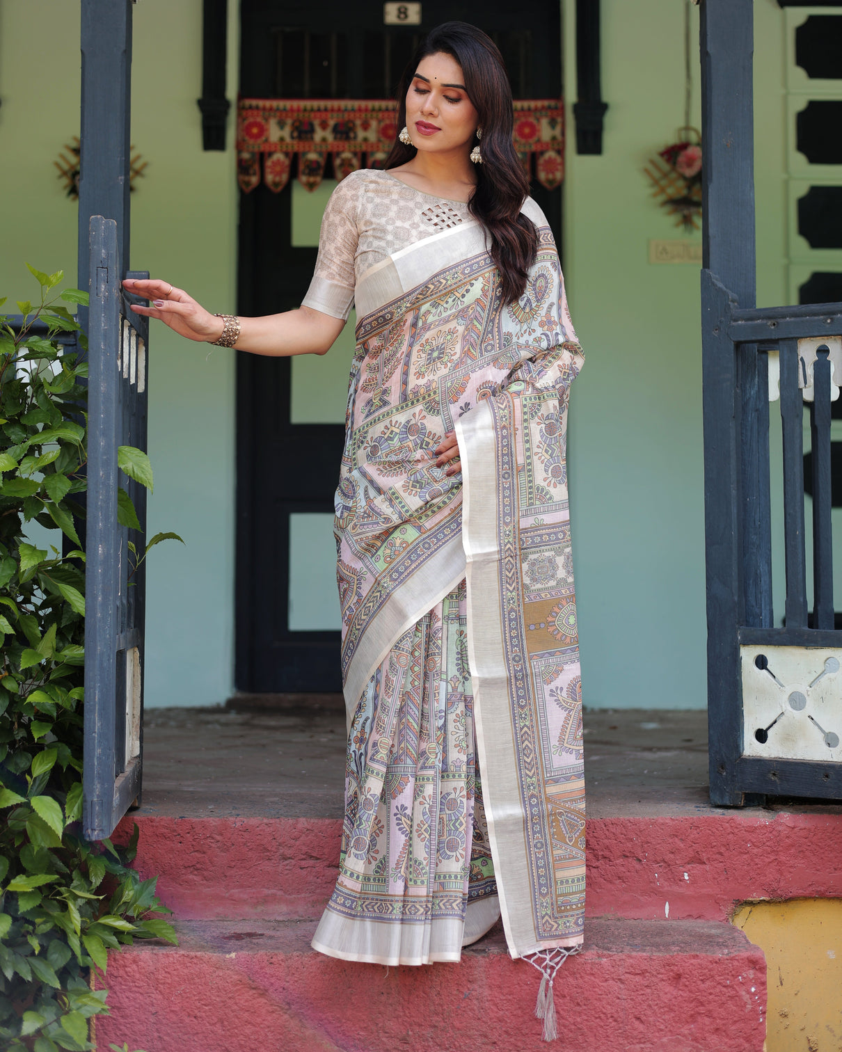 Cream and pastel multicolour printed pure cotton linen saree with blouse and tassels on edges