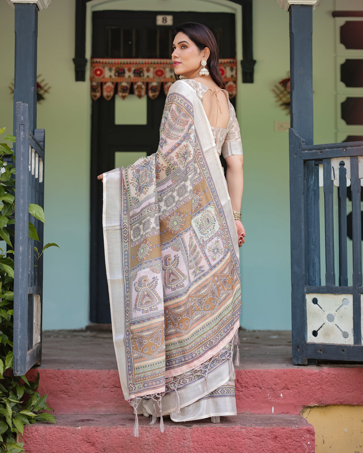 Cream and pastel multicolour printed pure cotton linen saree with blouse and tassels on edges