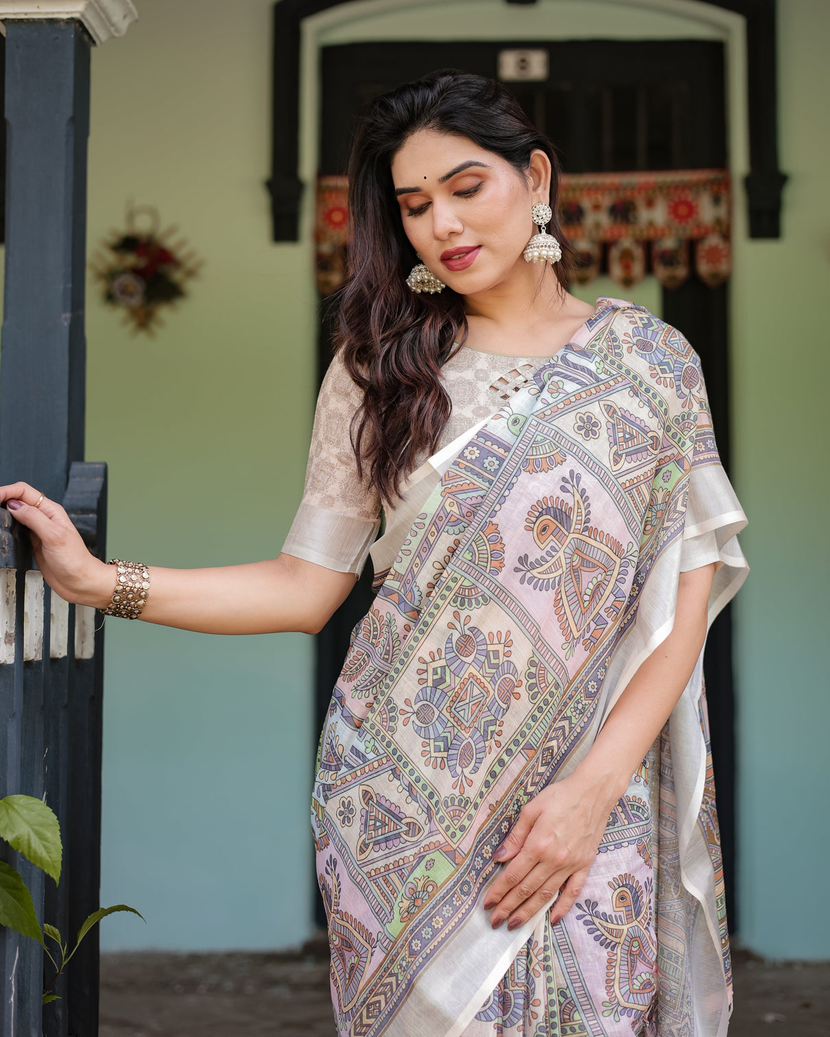 Cream and pastel multicolour printed pure cotton linen saree with blouse and tassels on edges