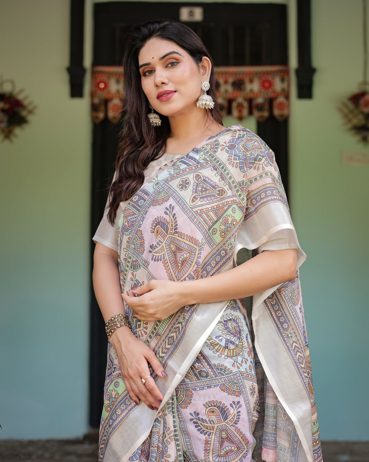 Cream and pastel multicolour printed pure cotton linen saree with blouse and tassels on edges