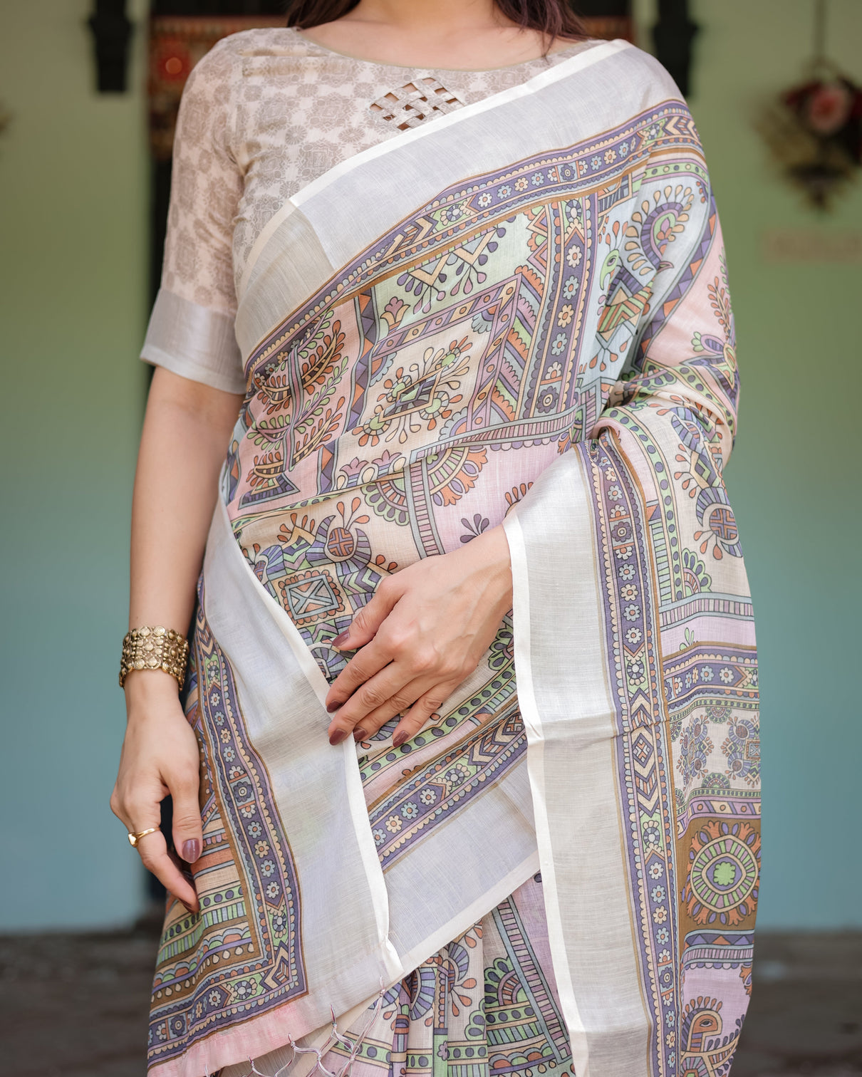 Cream and pastel multicolour printed pure cotton linen saree with blouse and tassels on edges