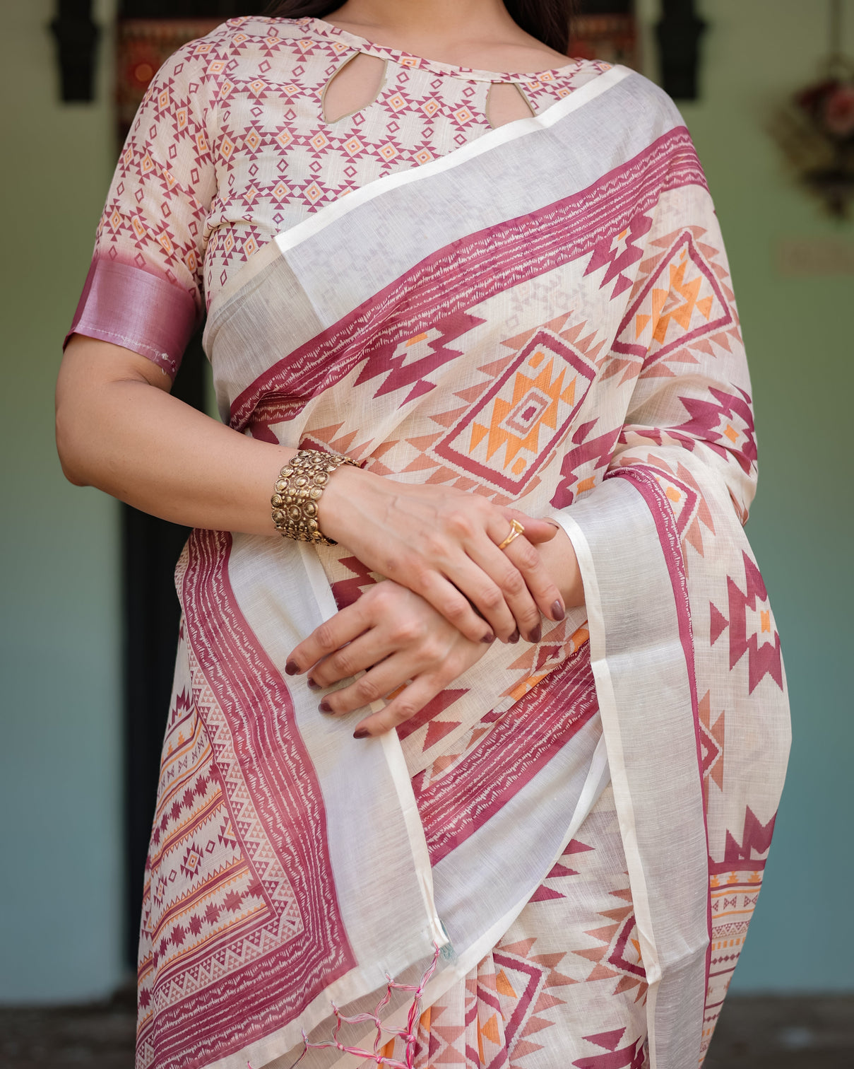 Cream and maroon geometric printed pure cotton linen saree with blouse and tassels