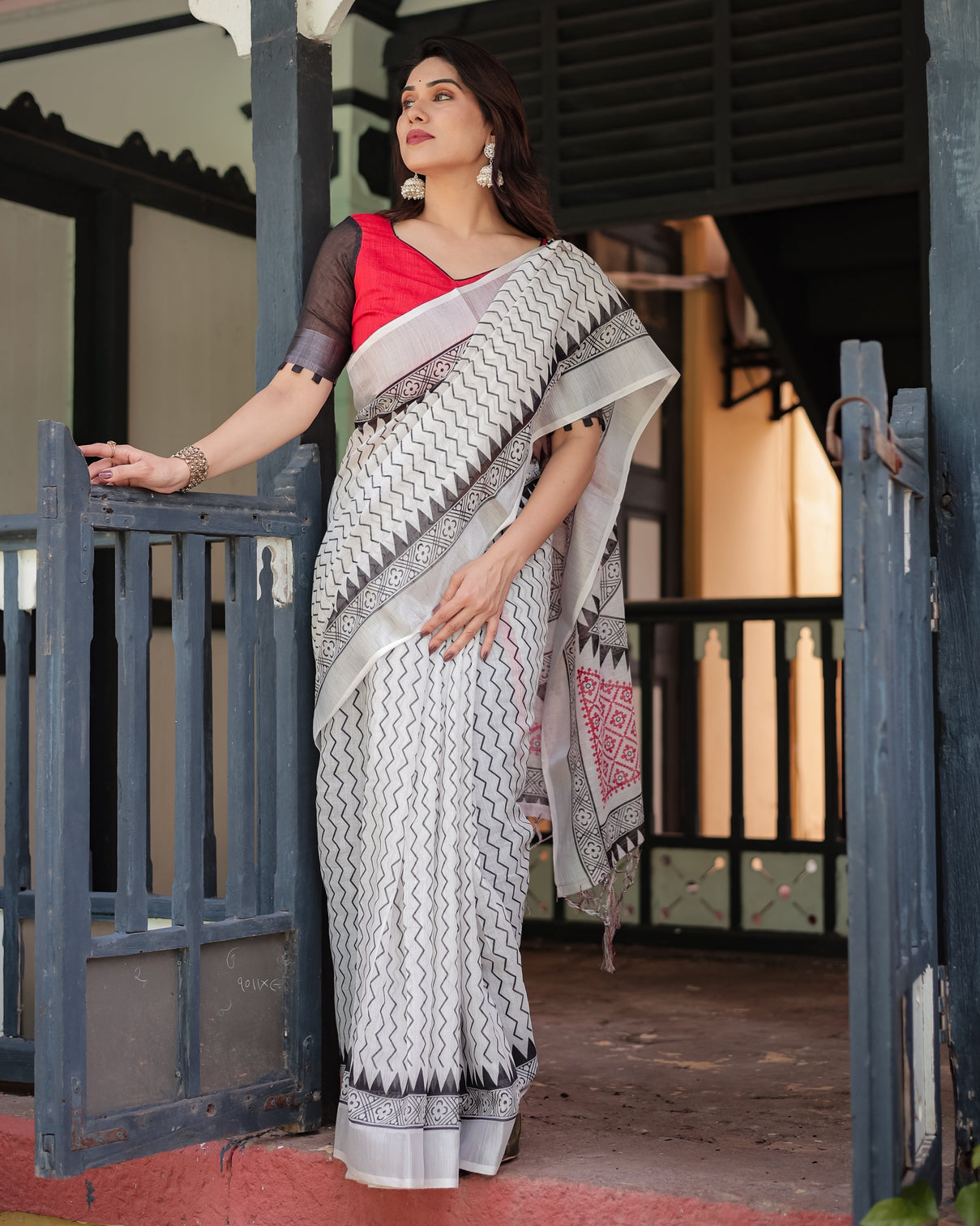 Black and white geometric pattern pure cotton linen saree with red accents blouse and tassel details