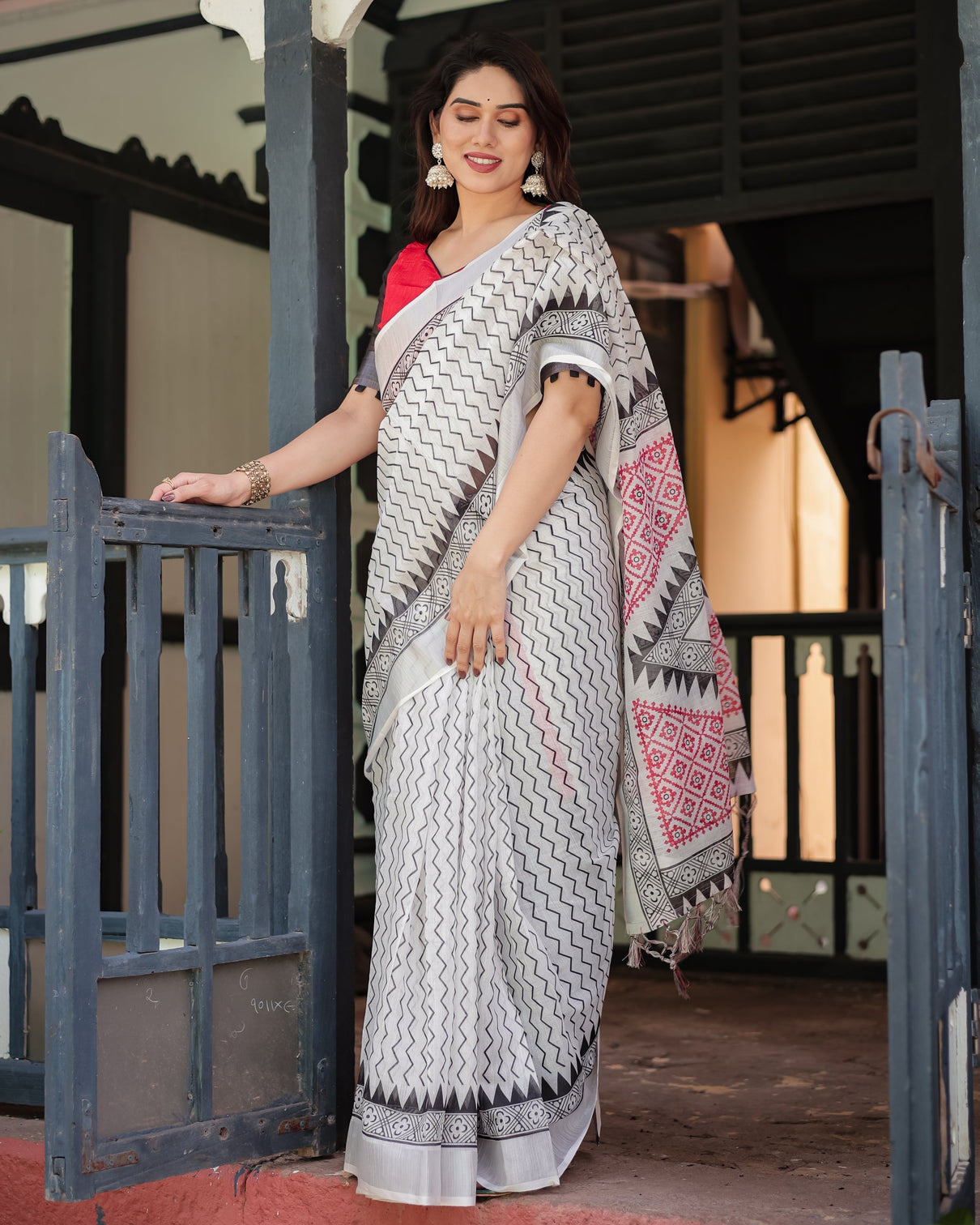 Black and white geometric pattern pure cotton linen saree with red accents blouse and tassel details