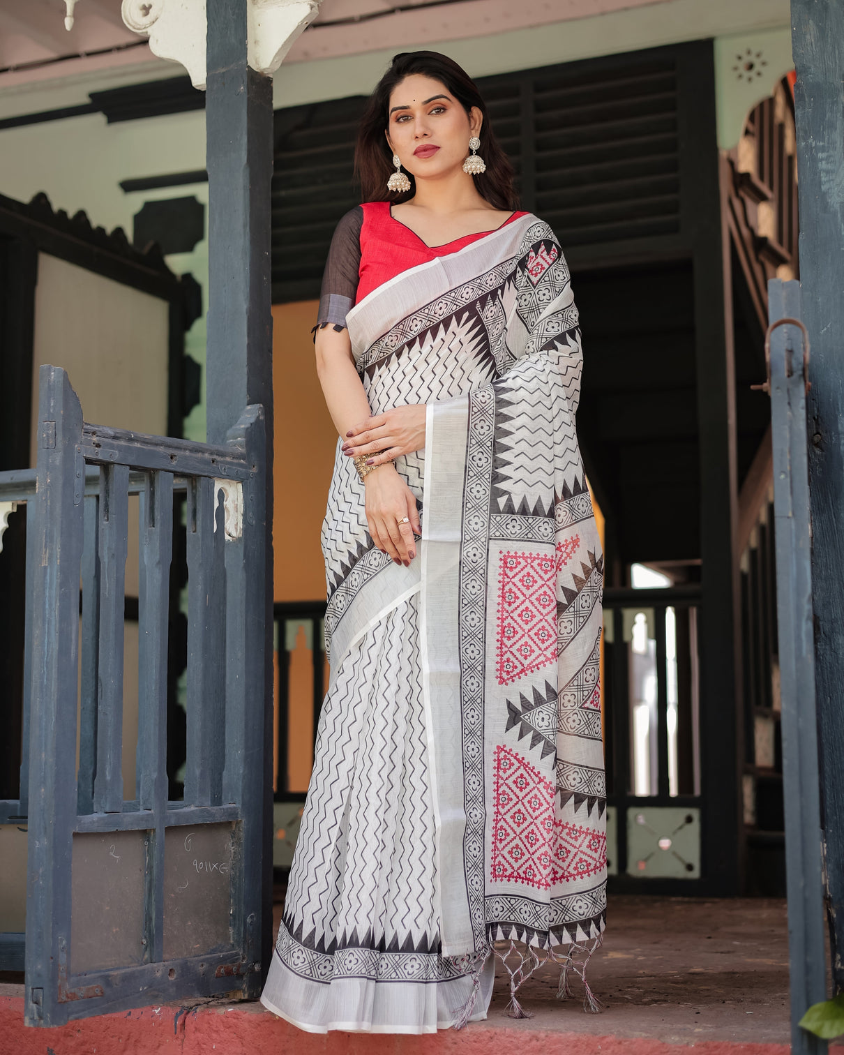 Black and white geometric pattern pure cotton linen saree with red accents blouse and tassel details