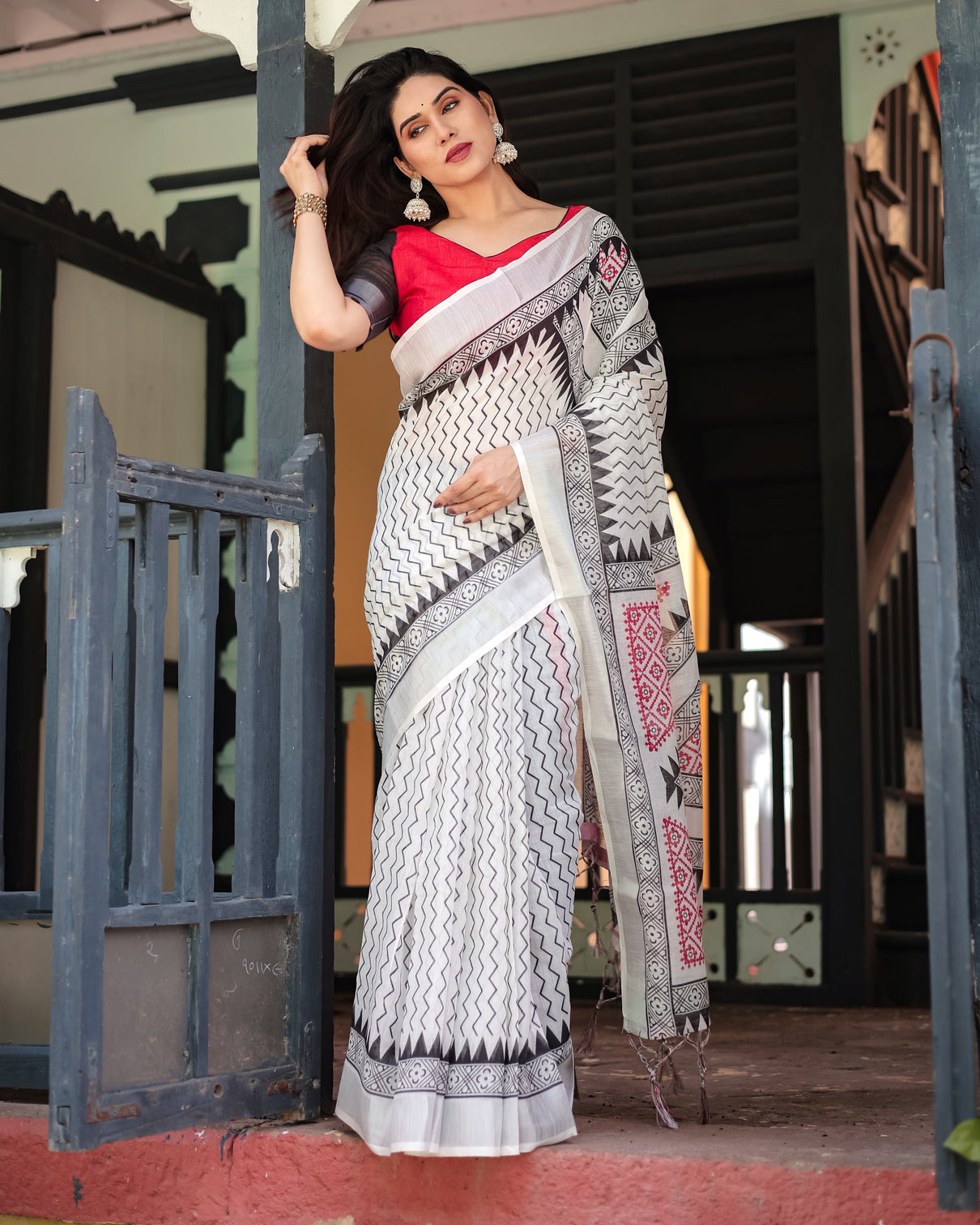 Black and white geometric pattern pure cotton linen saree with red accents blouse and tassel details